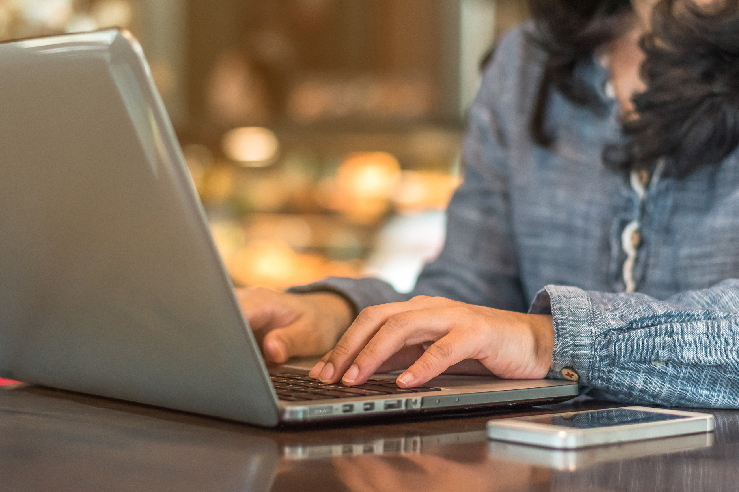 person typing on computer