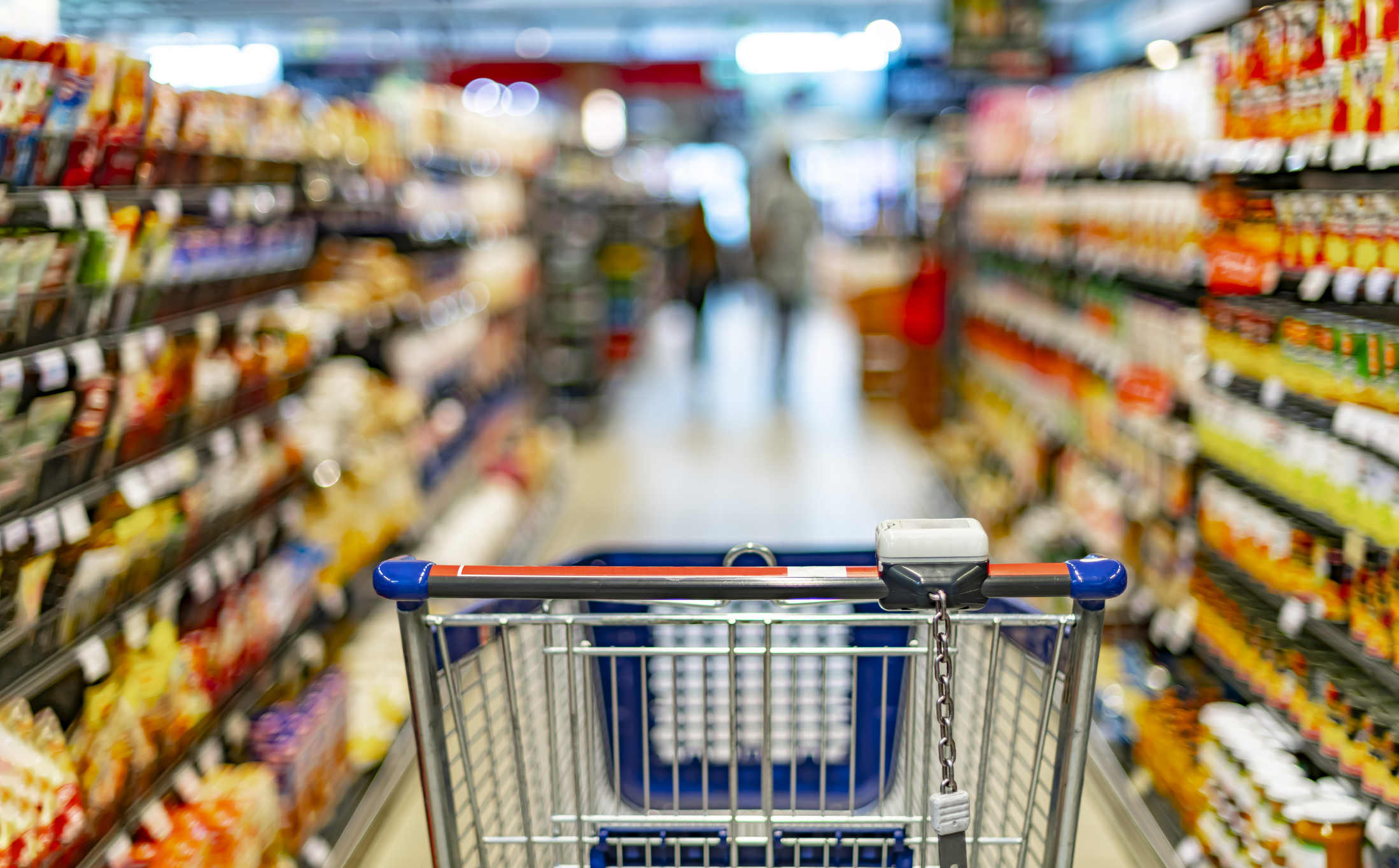 Grocery aisle and cart.