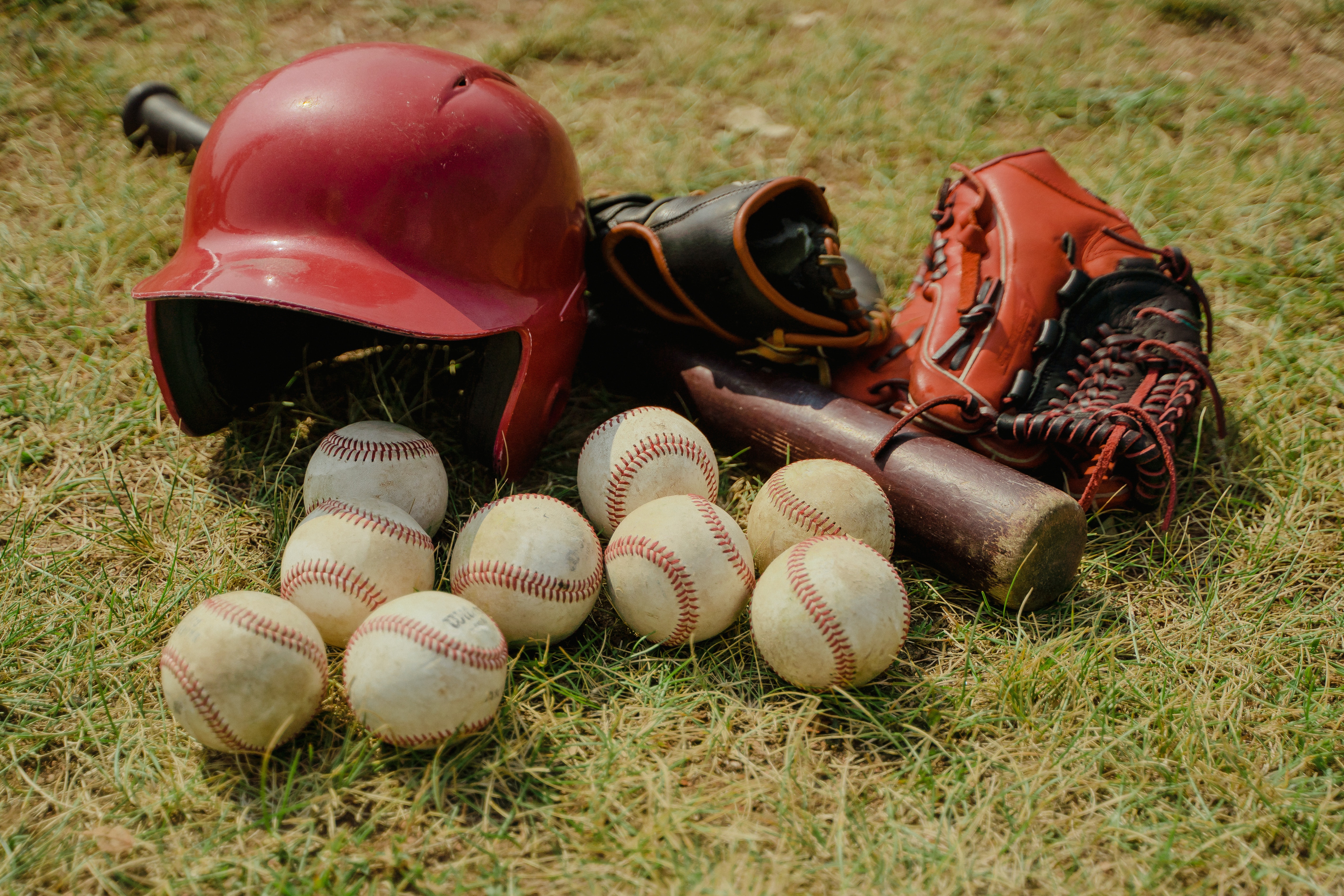 Baseballs, hat, gloves and bat