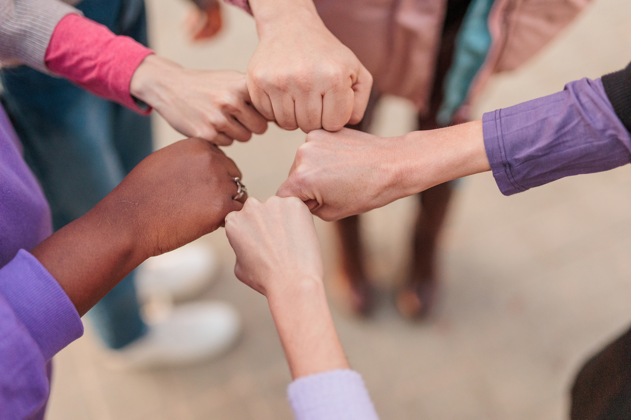 Women's hands in a circle