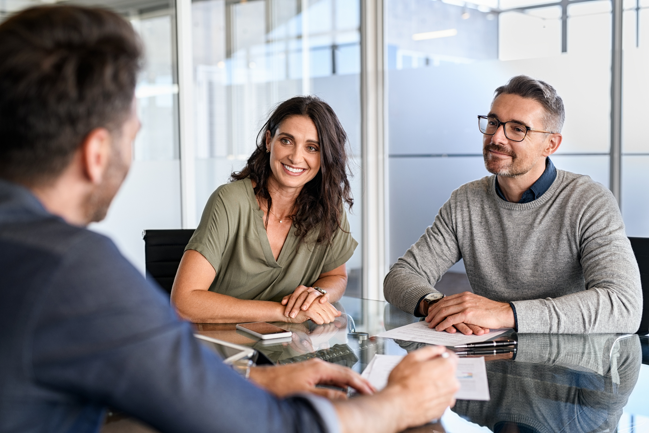 Three people at a desk