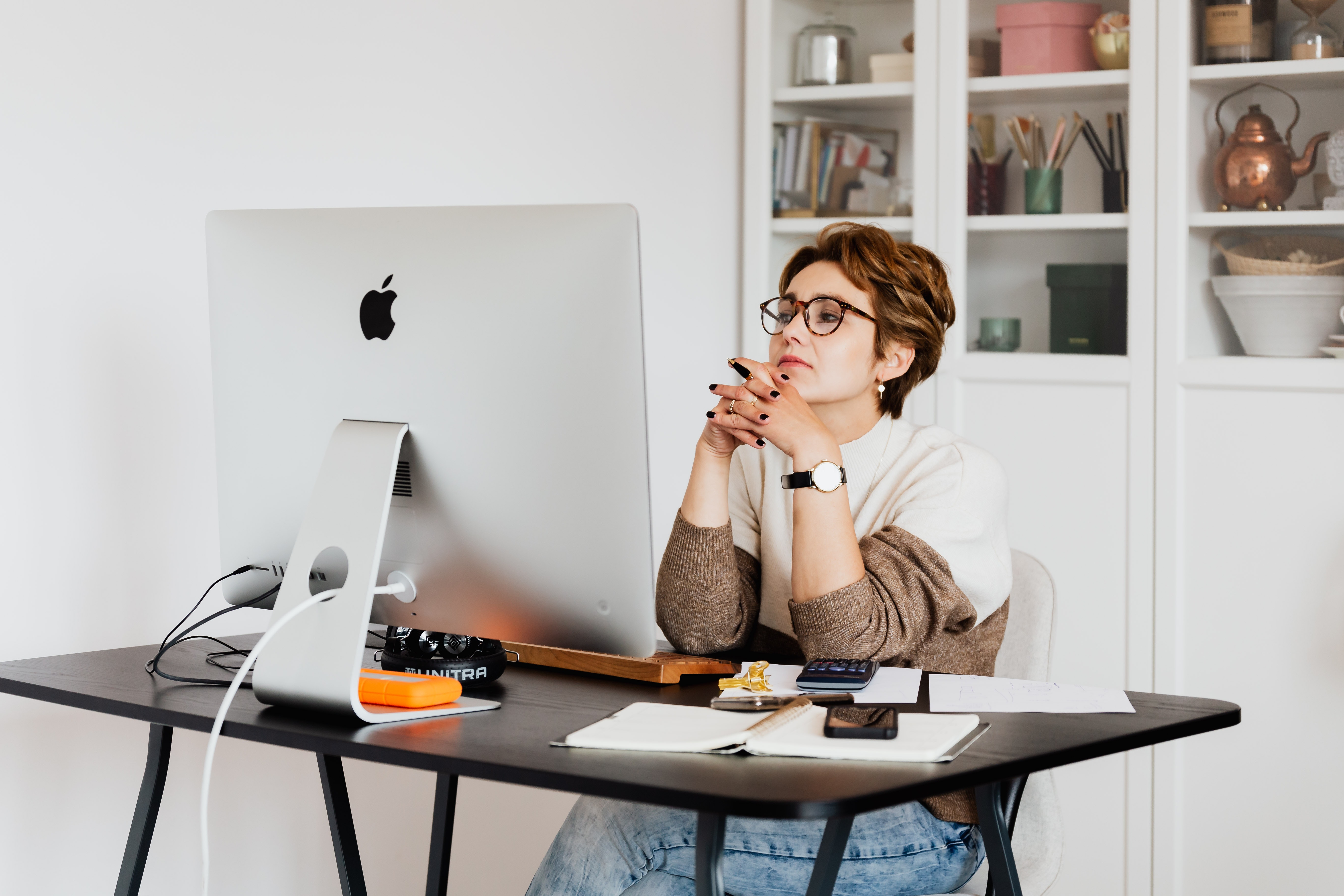 Woman seated at computre desk