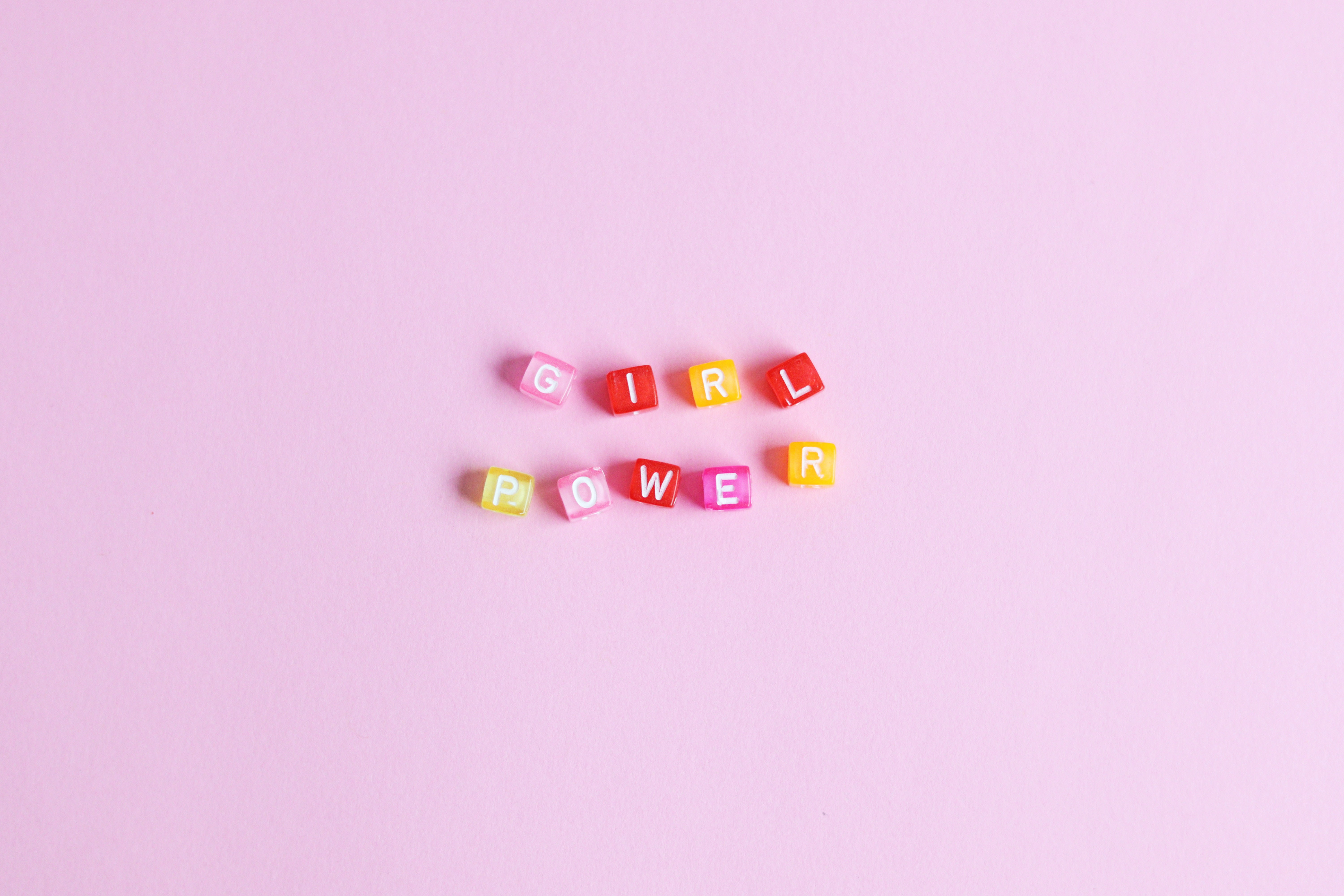 Beads that spell out "girl power".