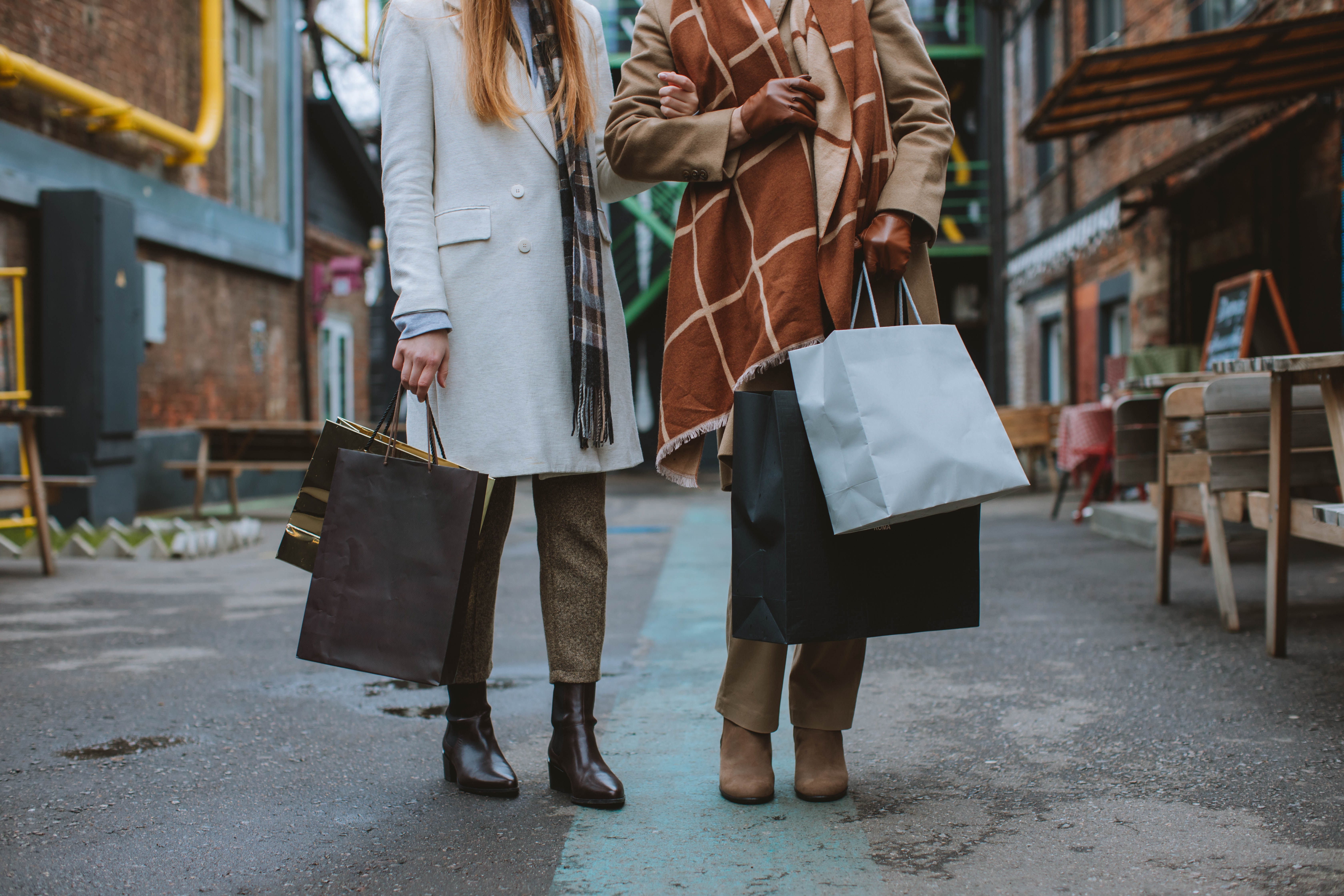 Women holding shopping bags.