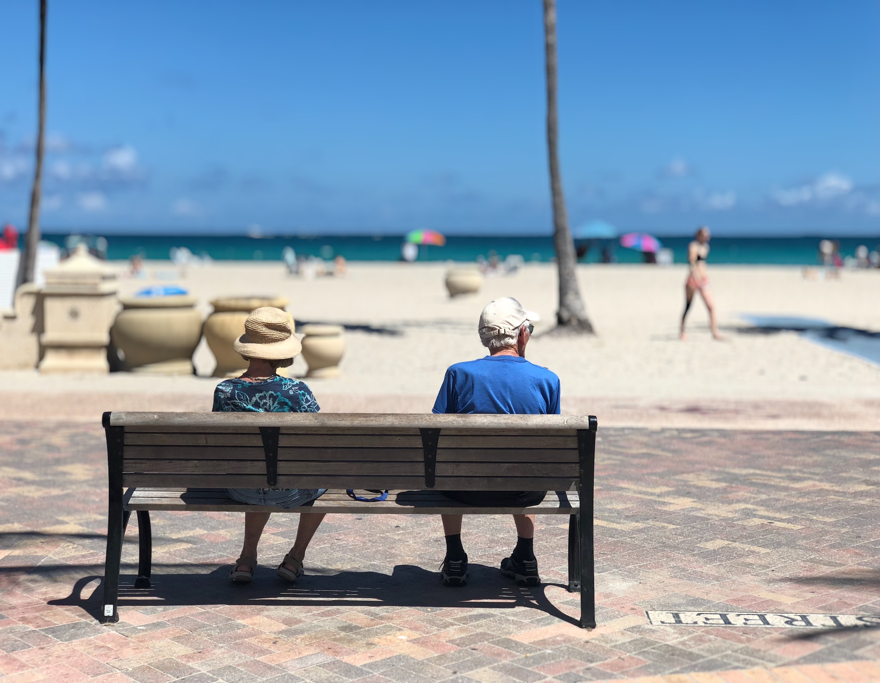 Two people sitting on a bench