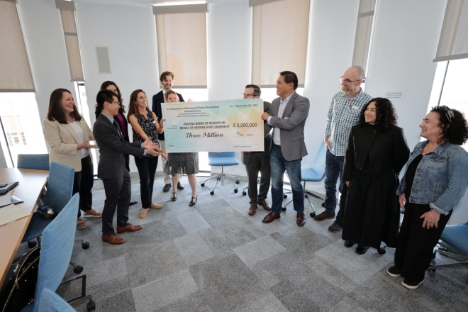 U.S. HUD representatives pass novelty check for $3 million to the ARCHES team.
