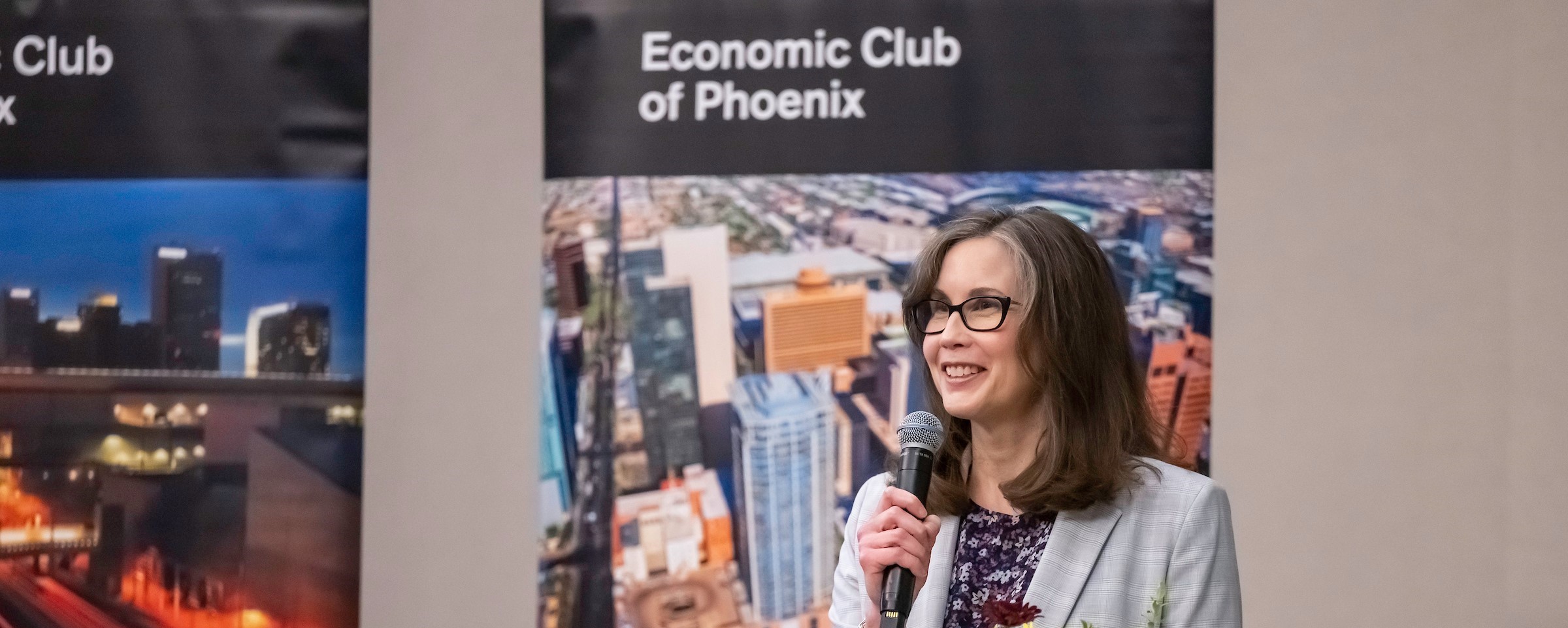 Amy Ostrom speaking at the Economic Club of Phoenix. 
