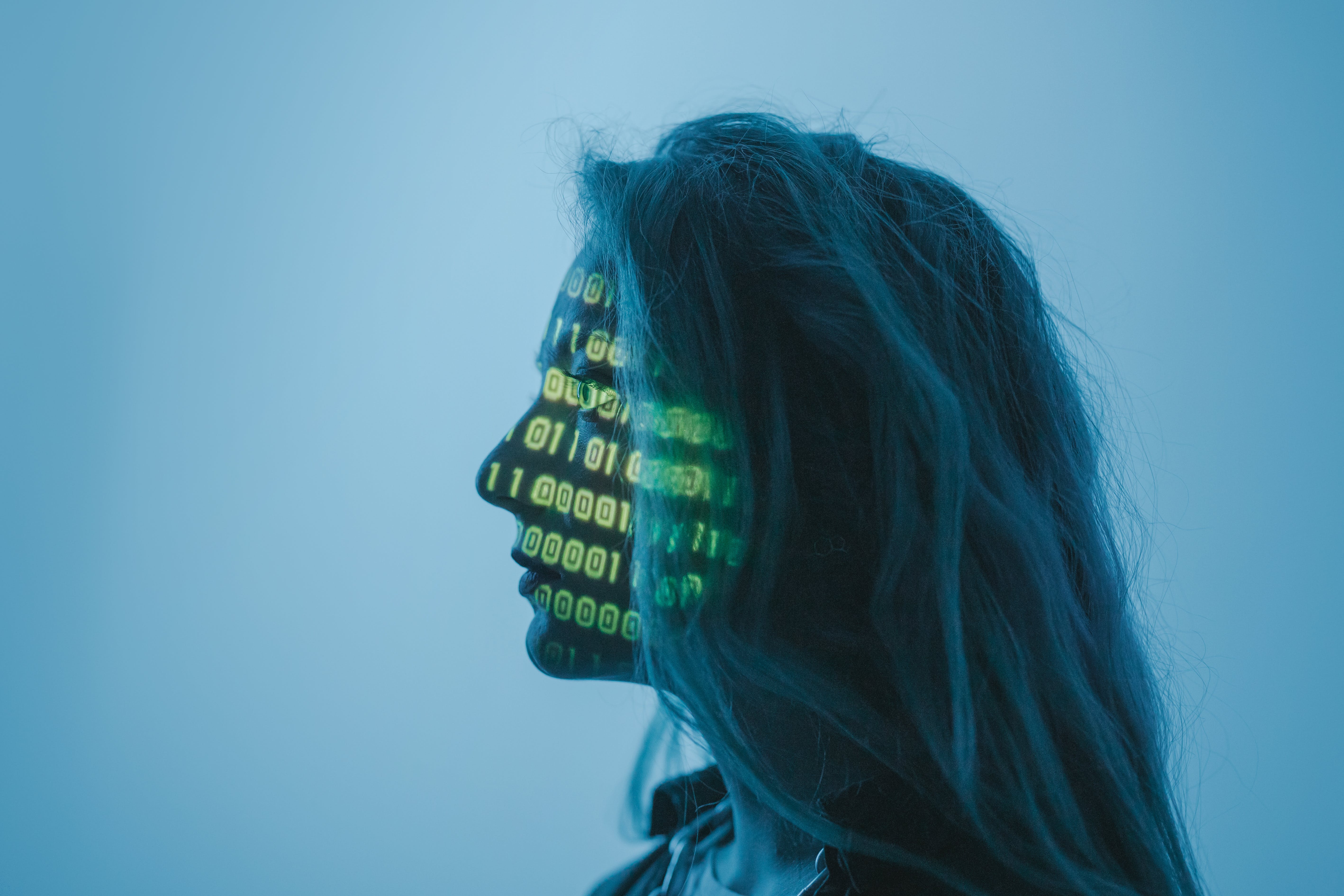 Woman with coding on her face.