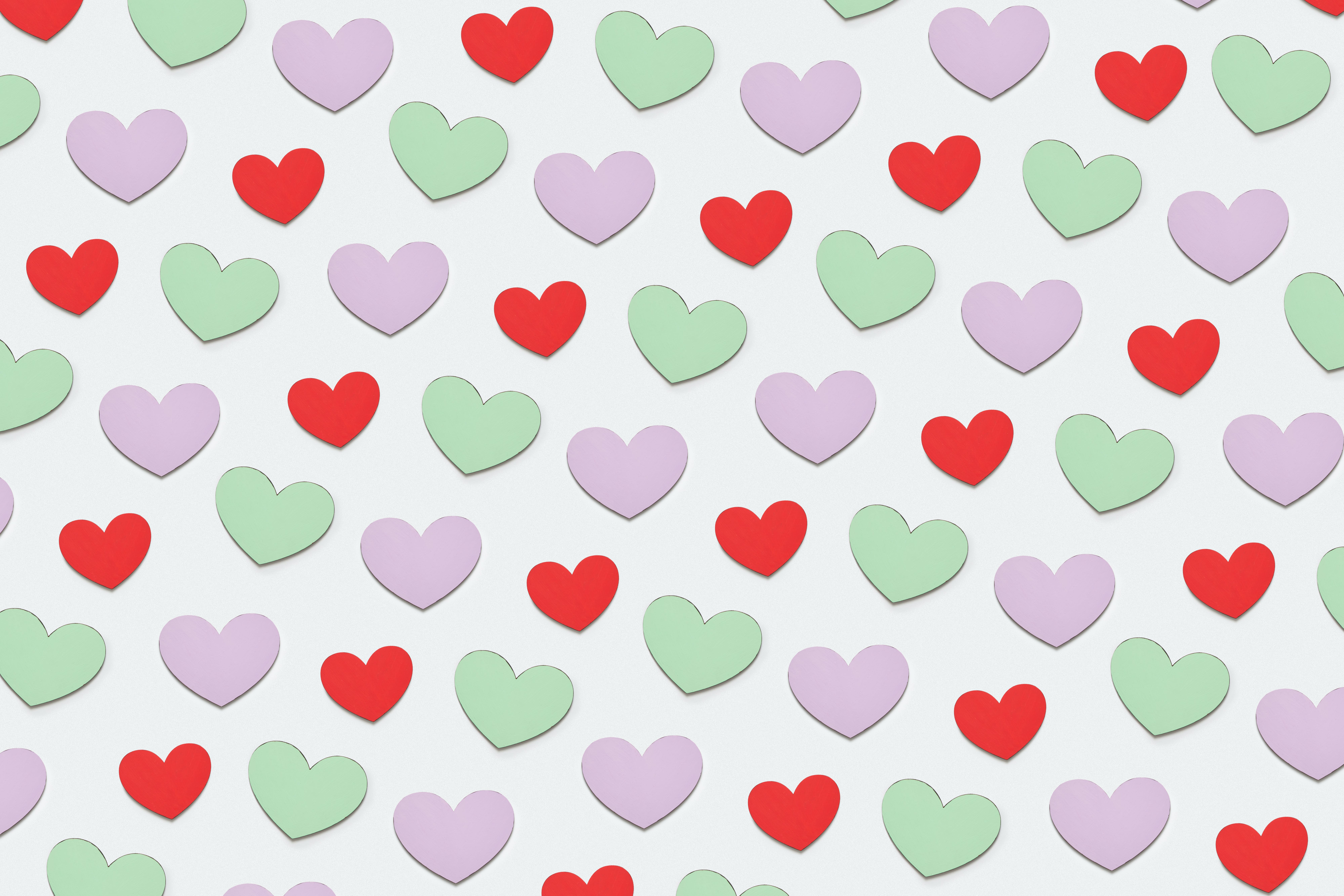 Pink, red, and green paper hearts.