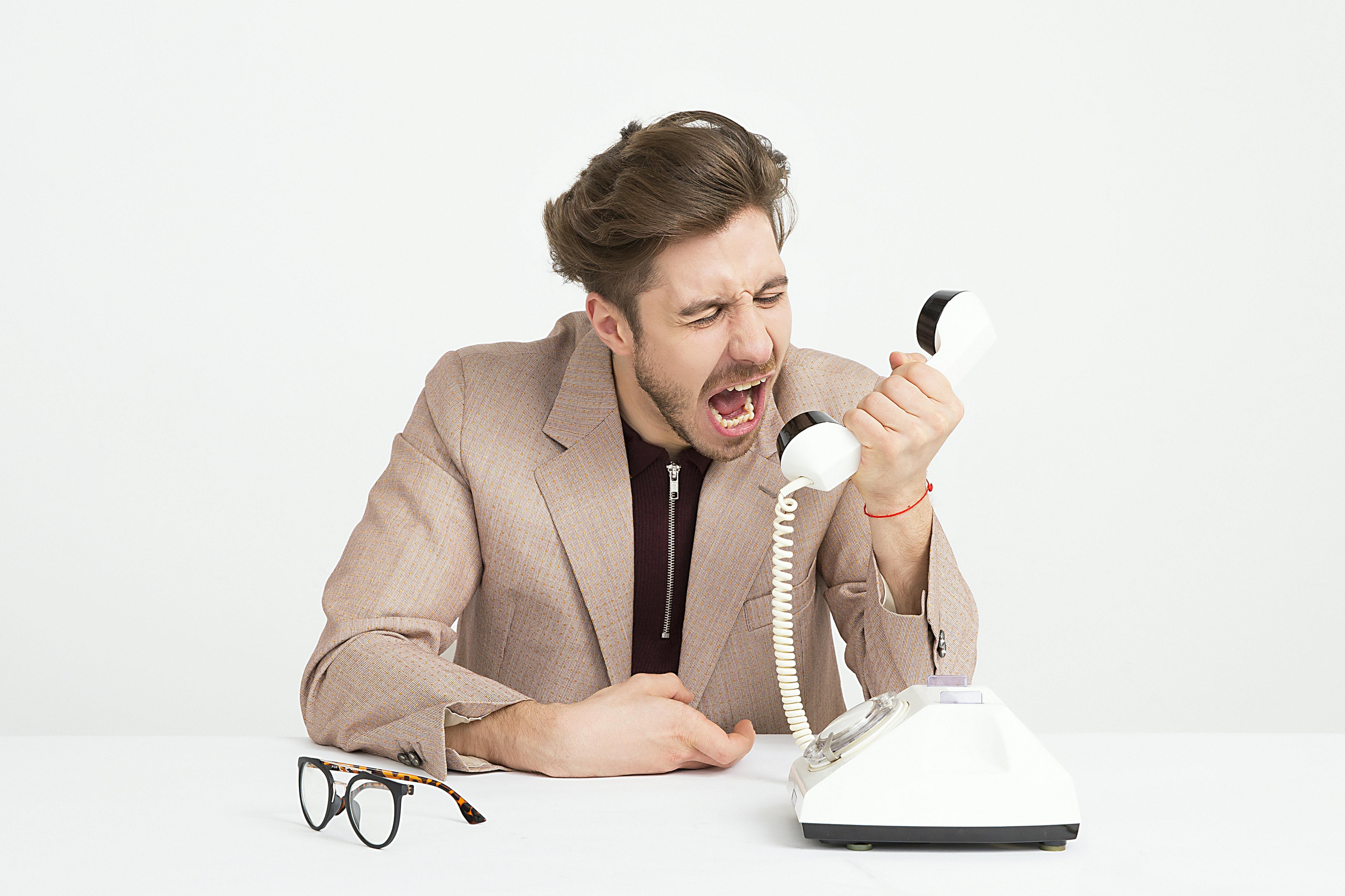 A person yelling into a phone.