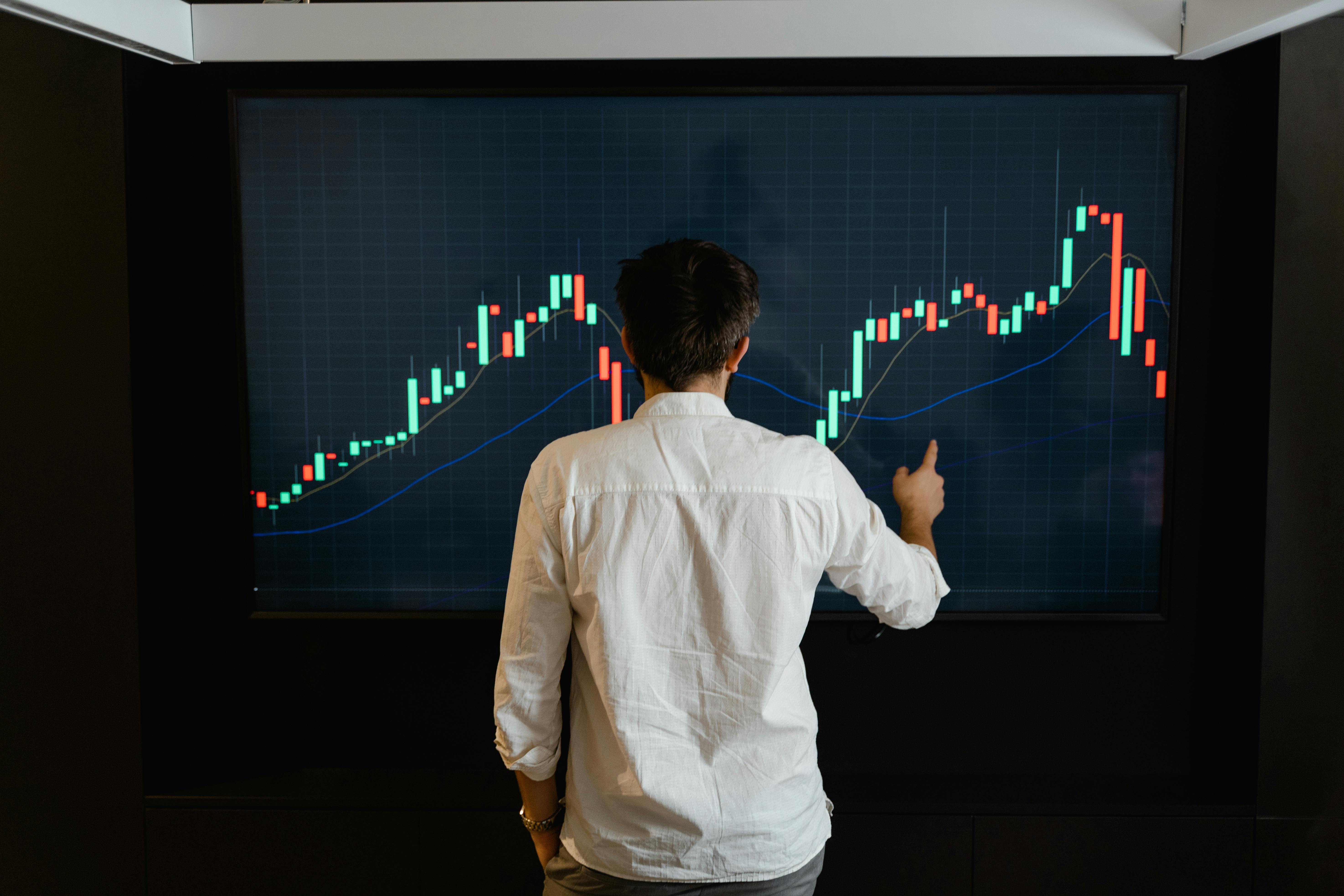 man standing in front of data