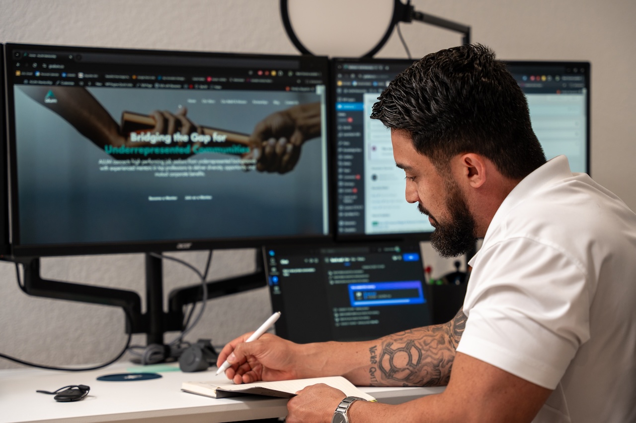 MBA alumnus Daniel Valdez working at his home computer