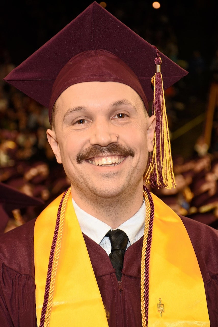 Global Logistics Management graduate Ryan Wilson at convocation in his cap and gown