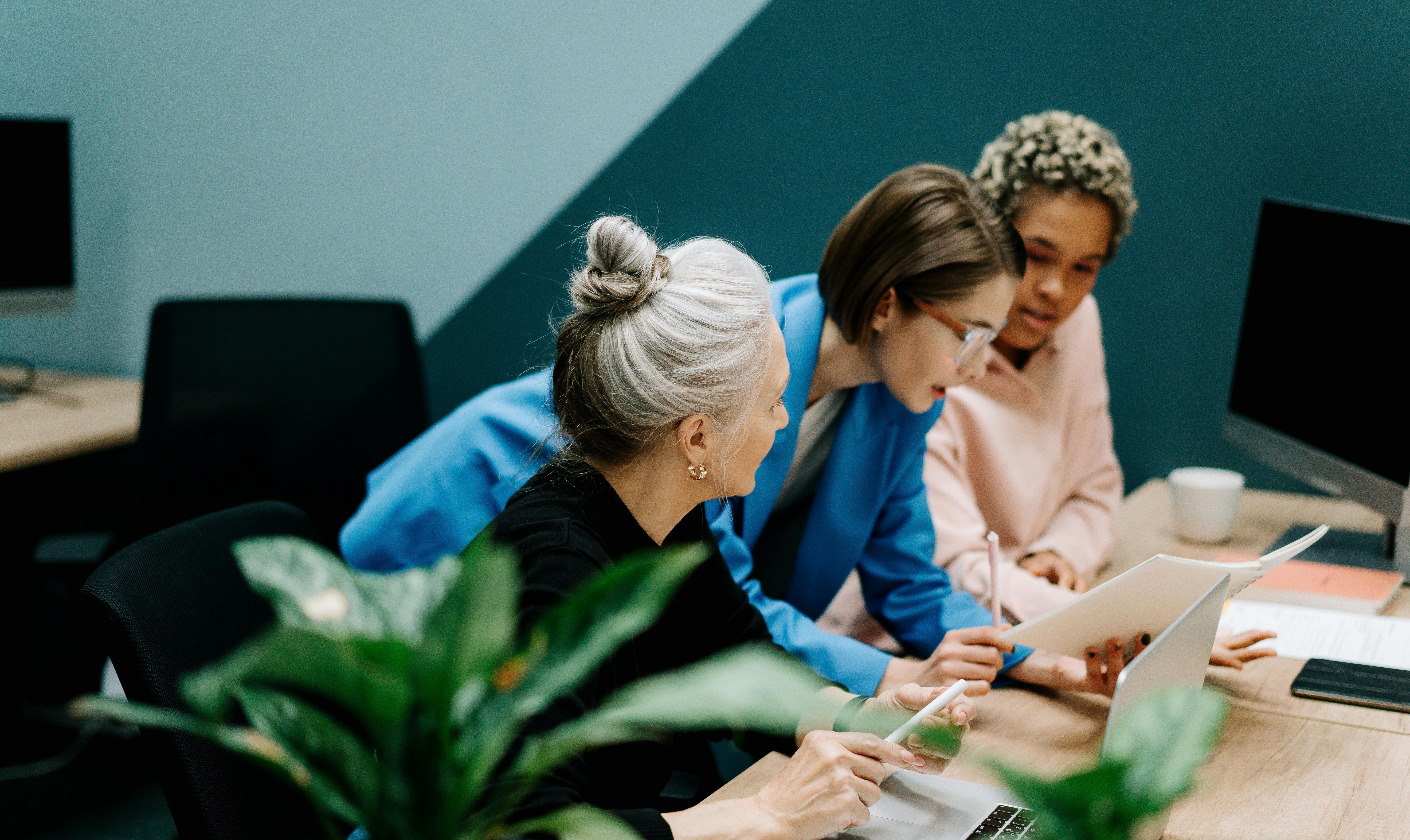 Three women in an office. 