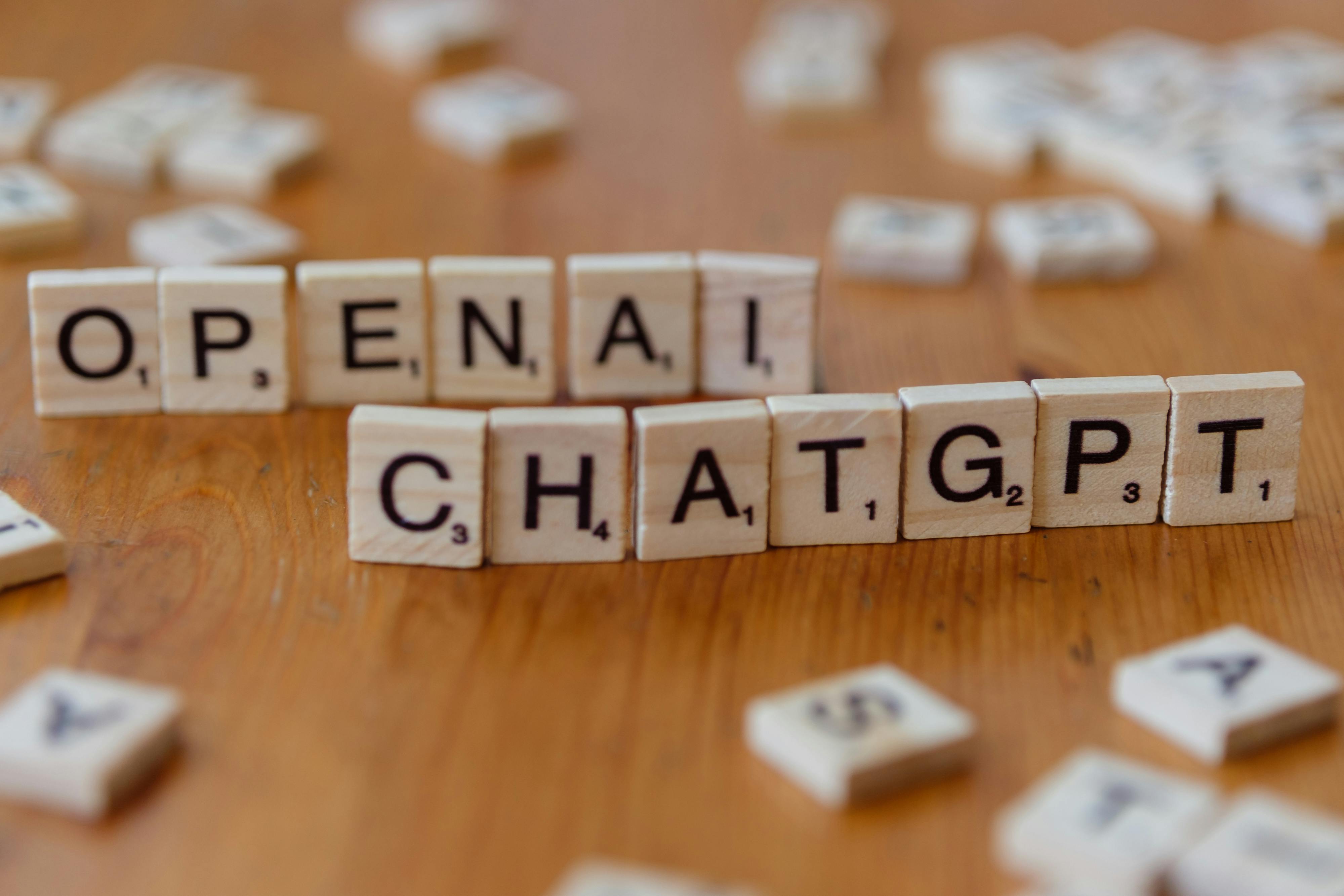 Photo depicting 'OpenAI' and 'ChatGPT' spelled out in Scrabble letters.