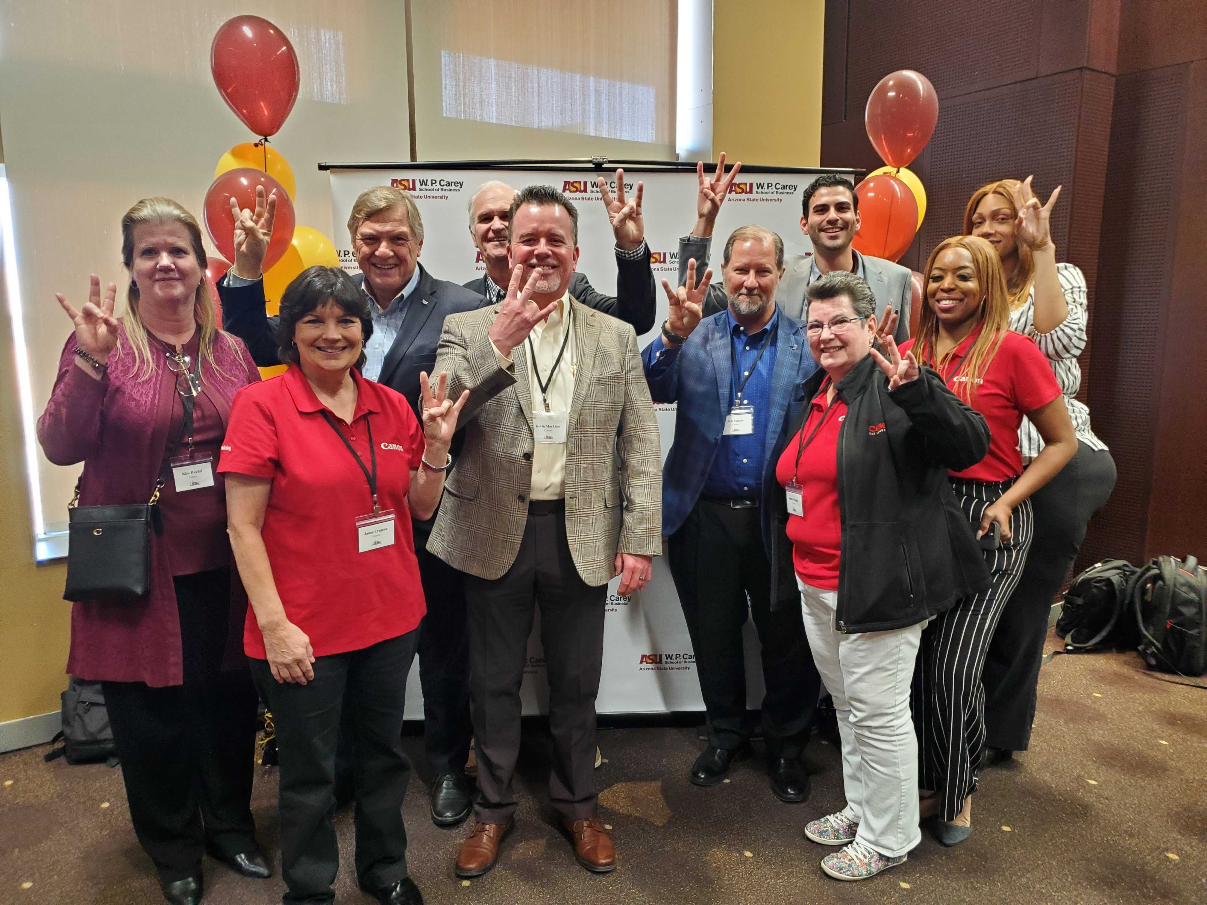 Canon employees pose at the ACSC career event.