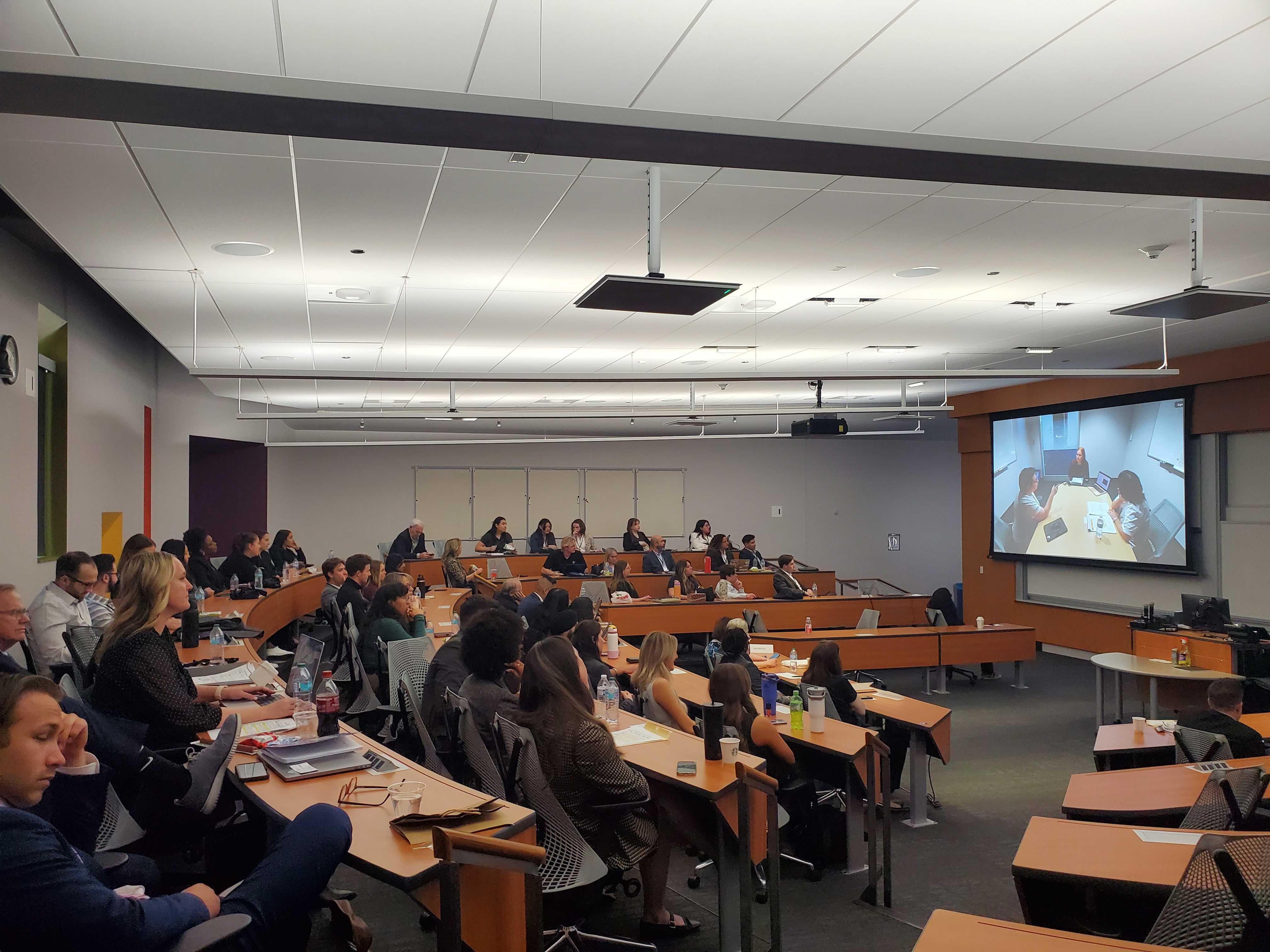 Students watch the ACSC competition finalists.