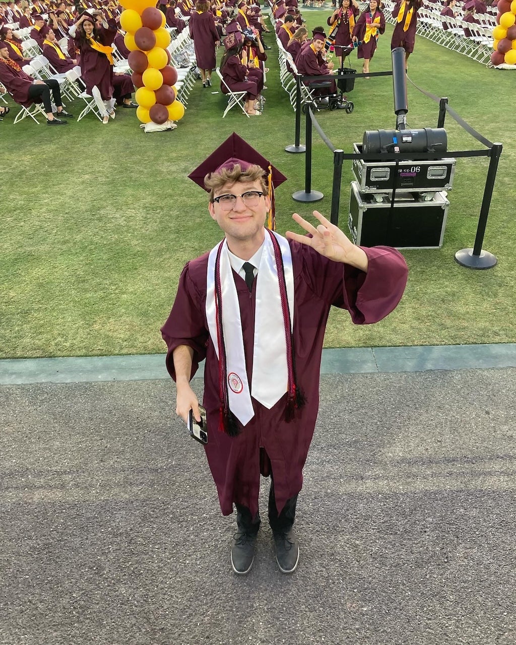 High-angle shot of MACC student Davis Taylor at his undergraduate graduation from ASU