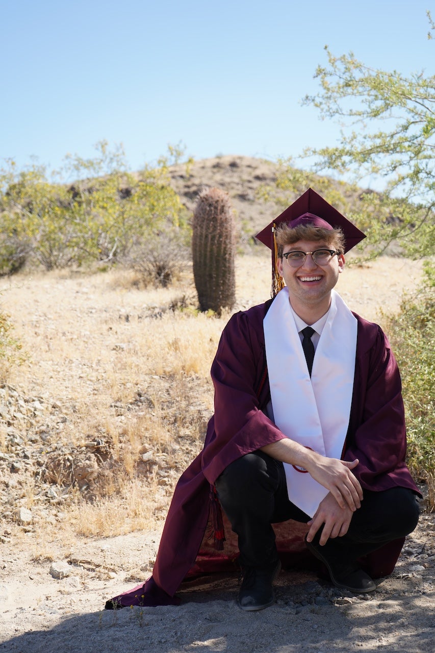 MACC student Davis Taylor in the desert for a graduation photoshoot