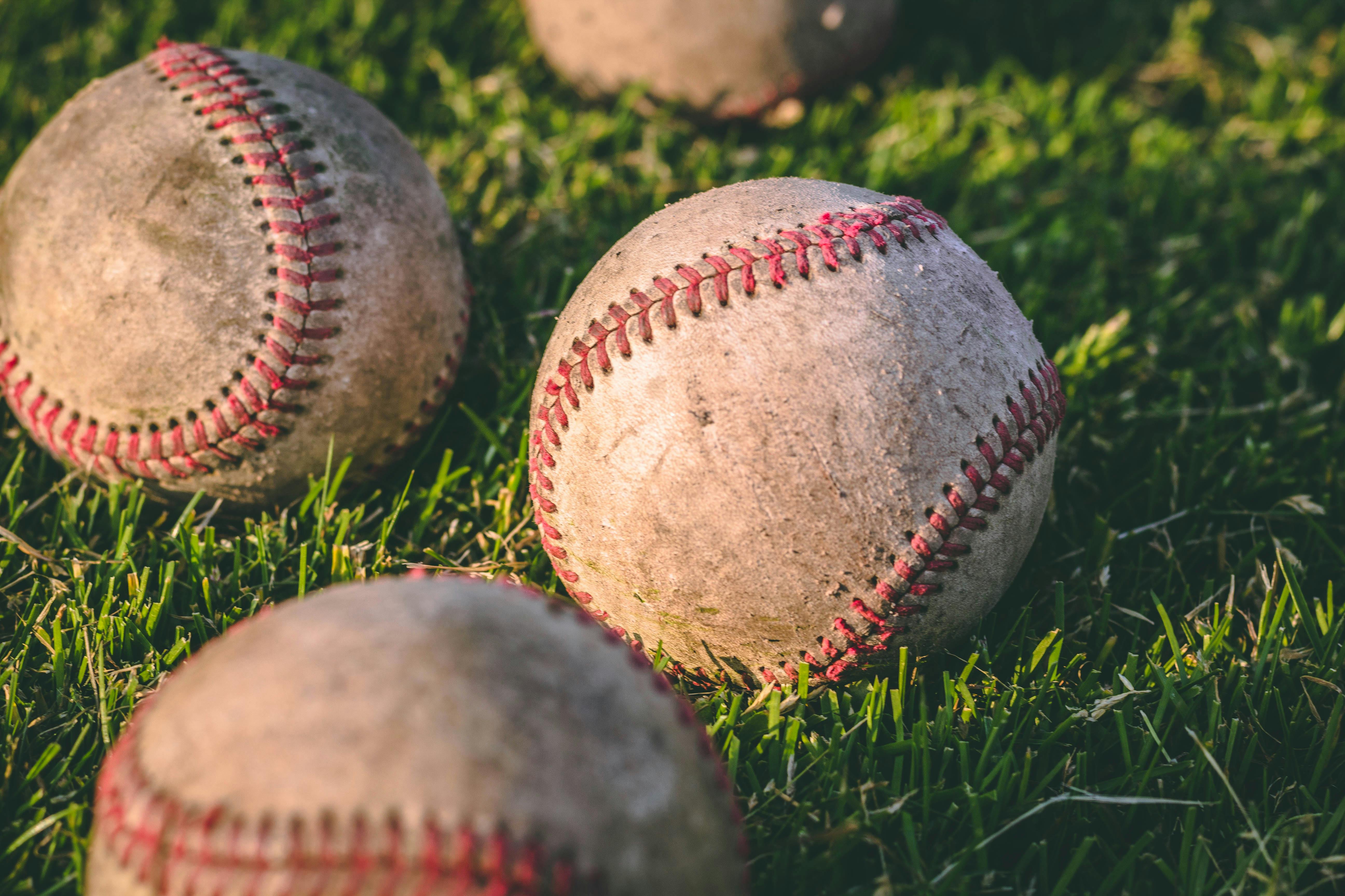 Baseballs in a field.