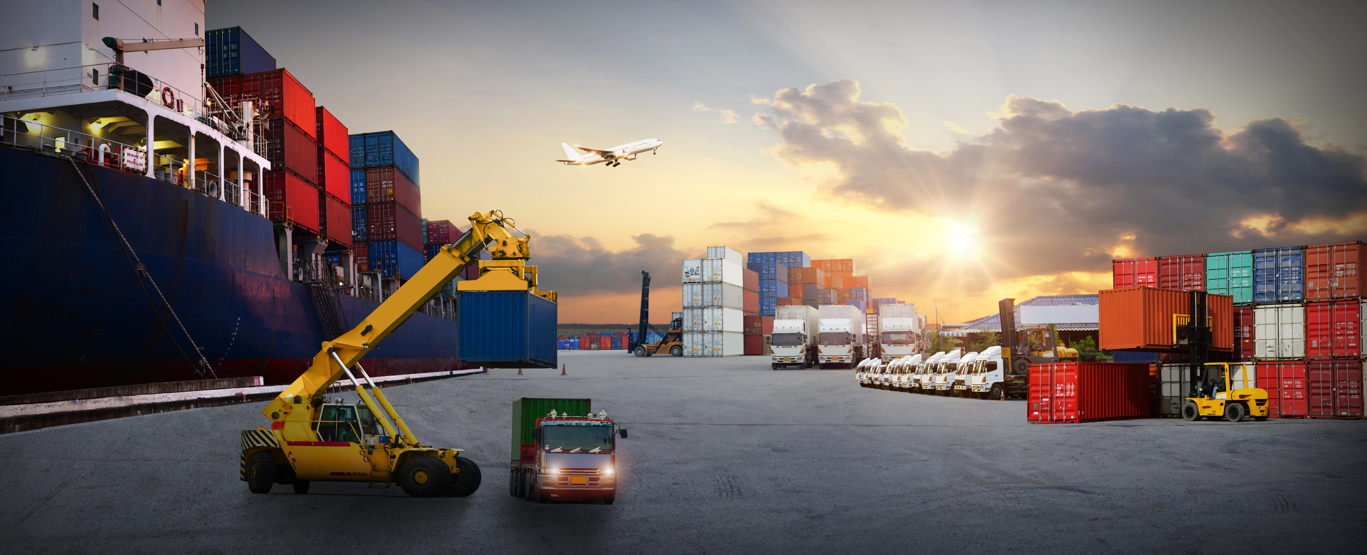 A crane, truck, plane, and shipping containers.