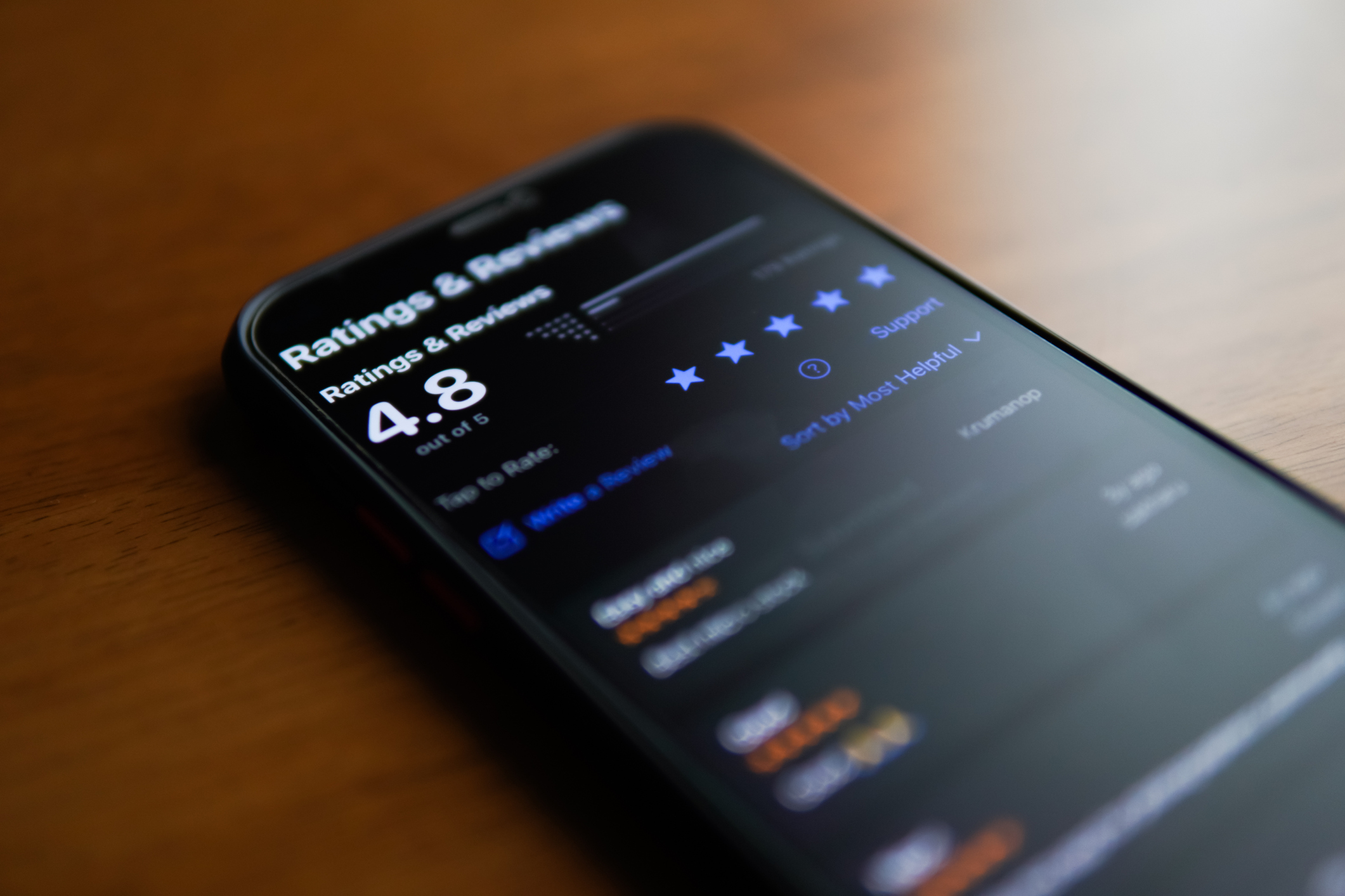 A phone with a company review page opened.