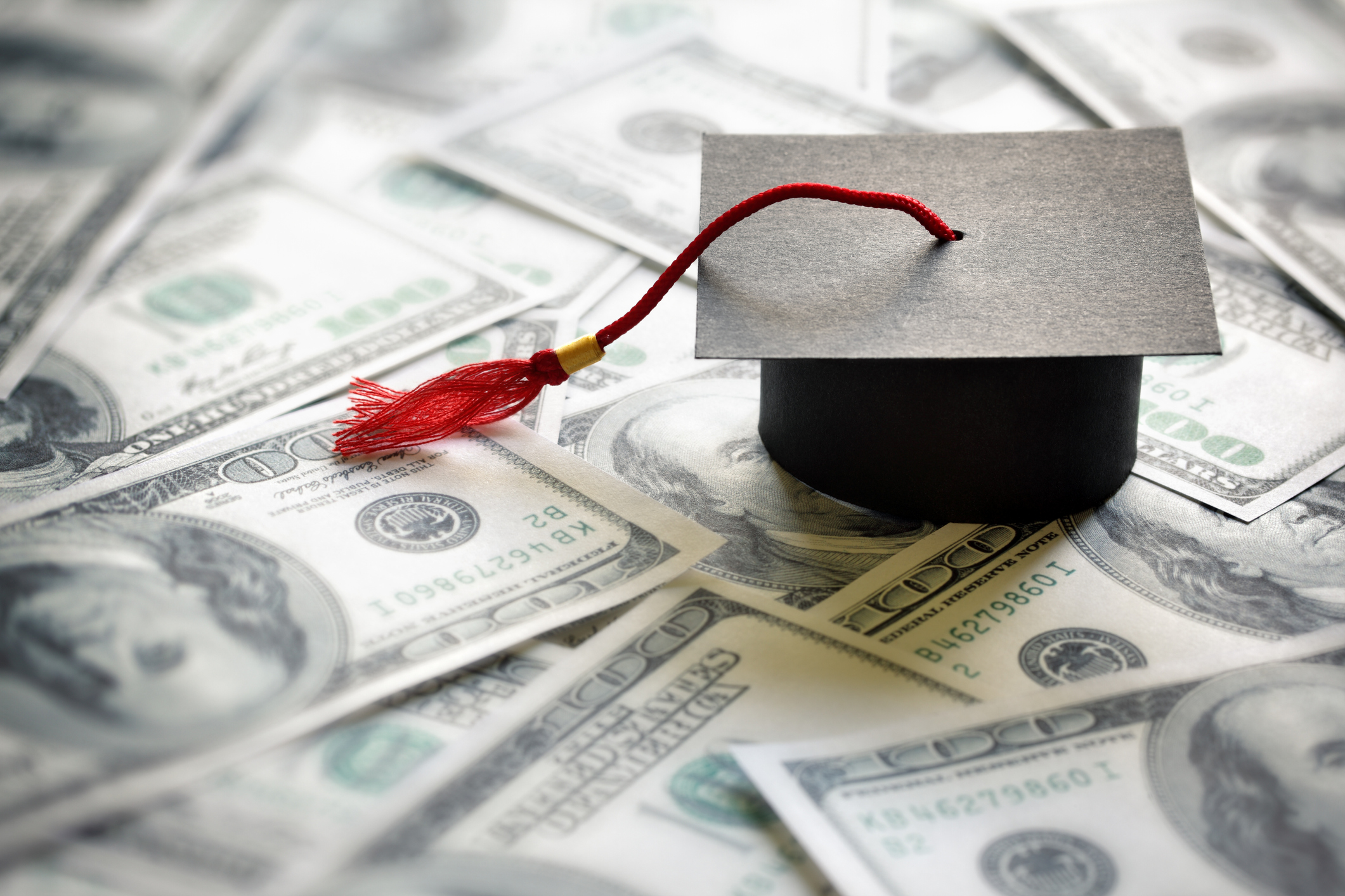 Graduation hat and $100 bills