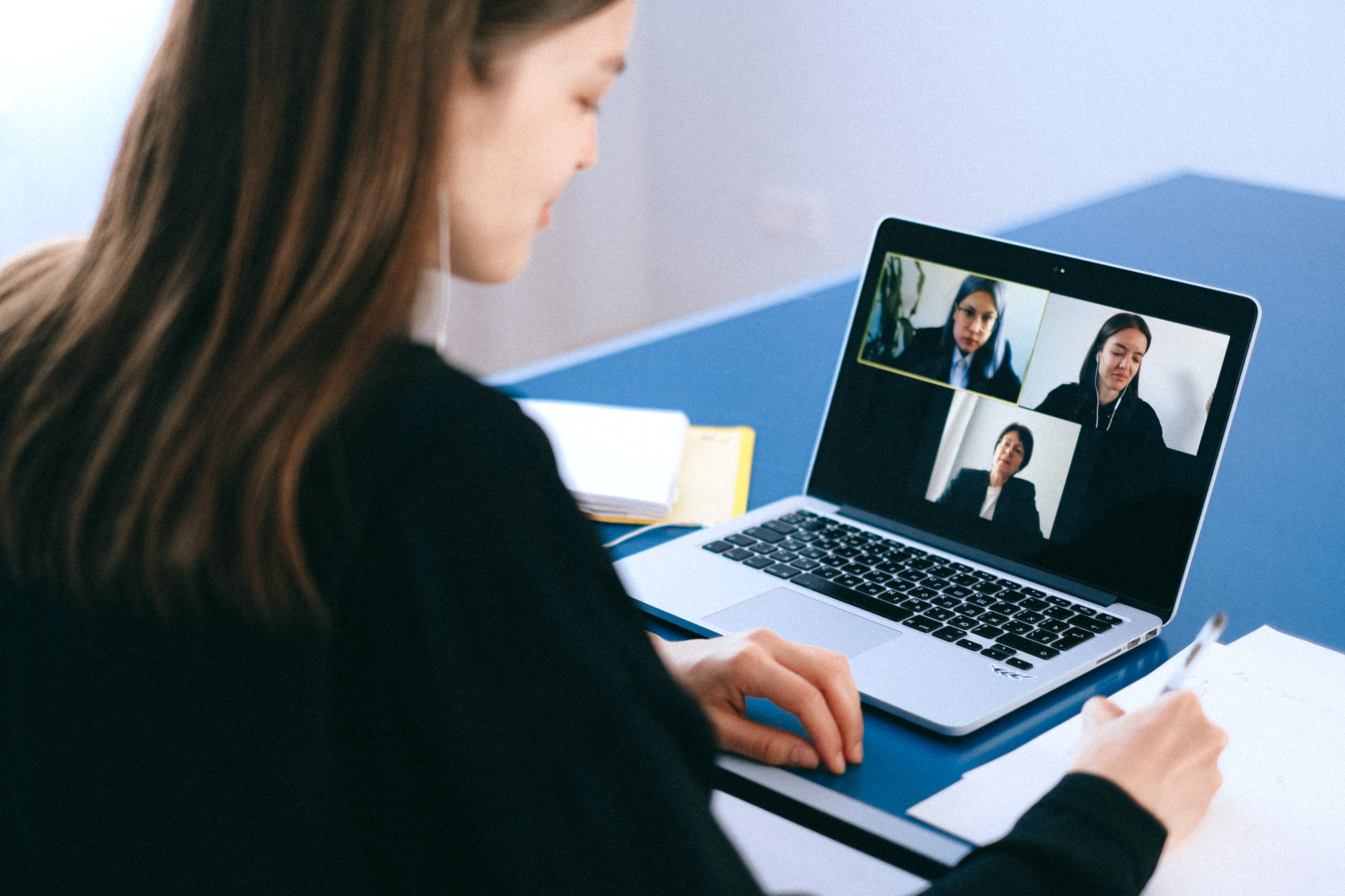 Woman on Zoom call.