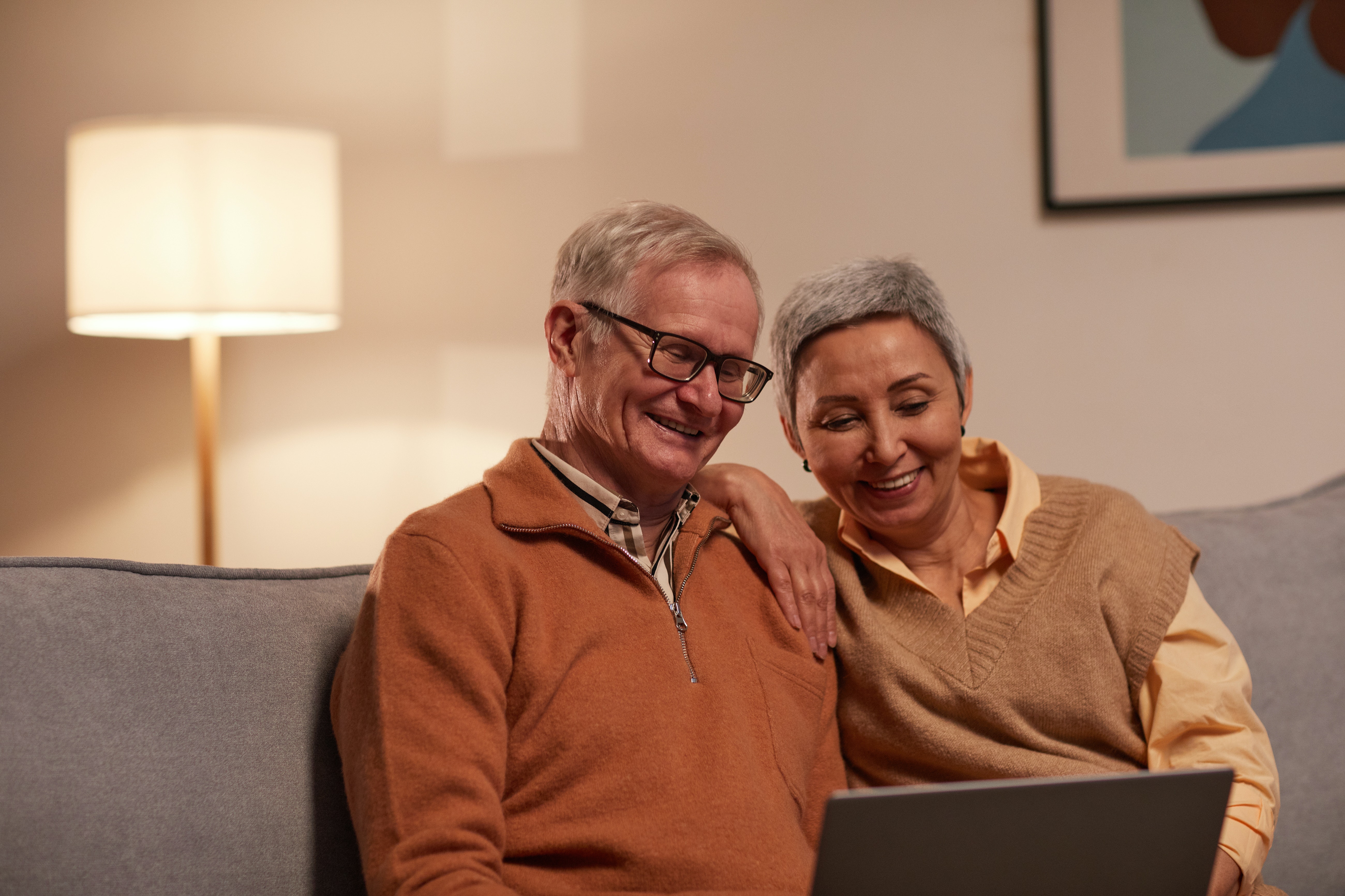 Couple sitting together on couch.