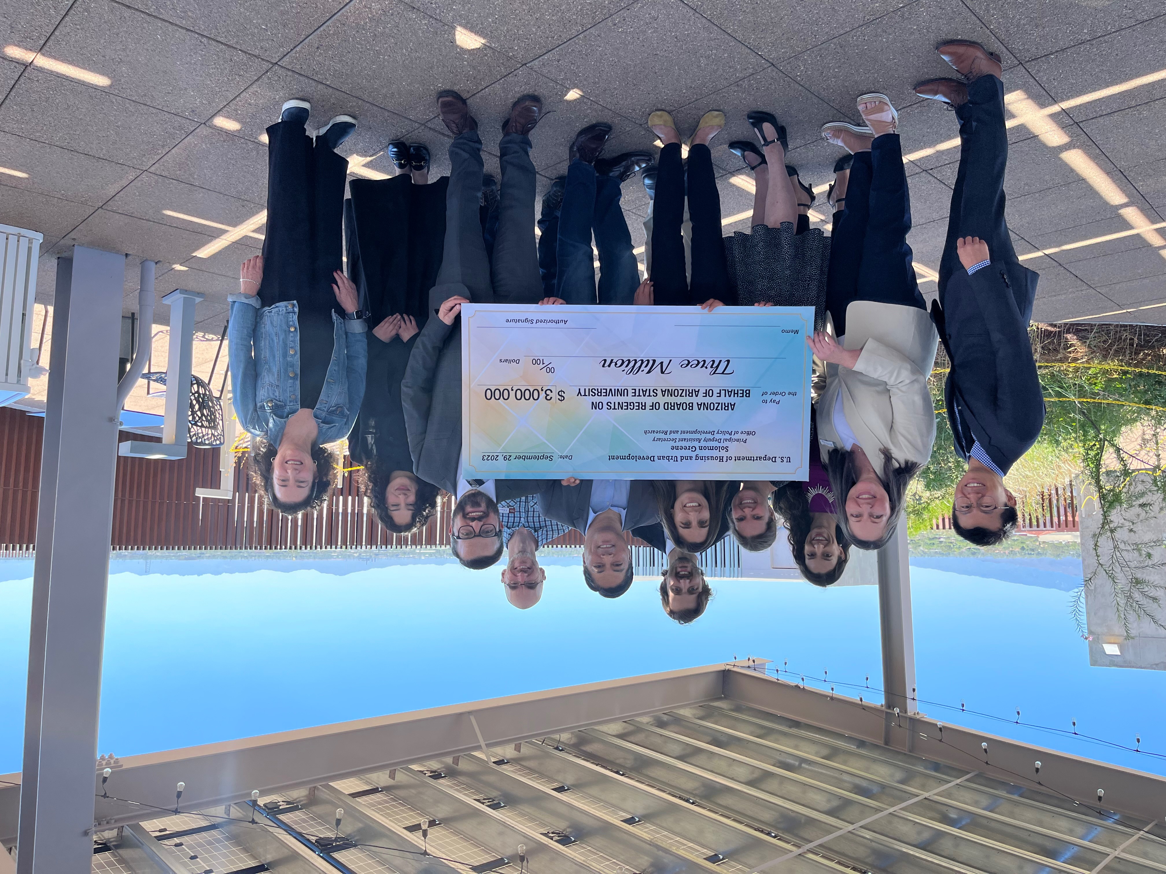 The ARCHES team accepts a check from the U.S. Department of Housing and Urban Development.