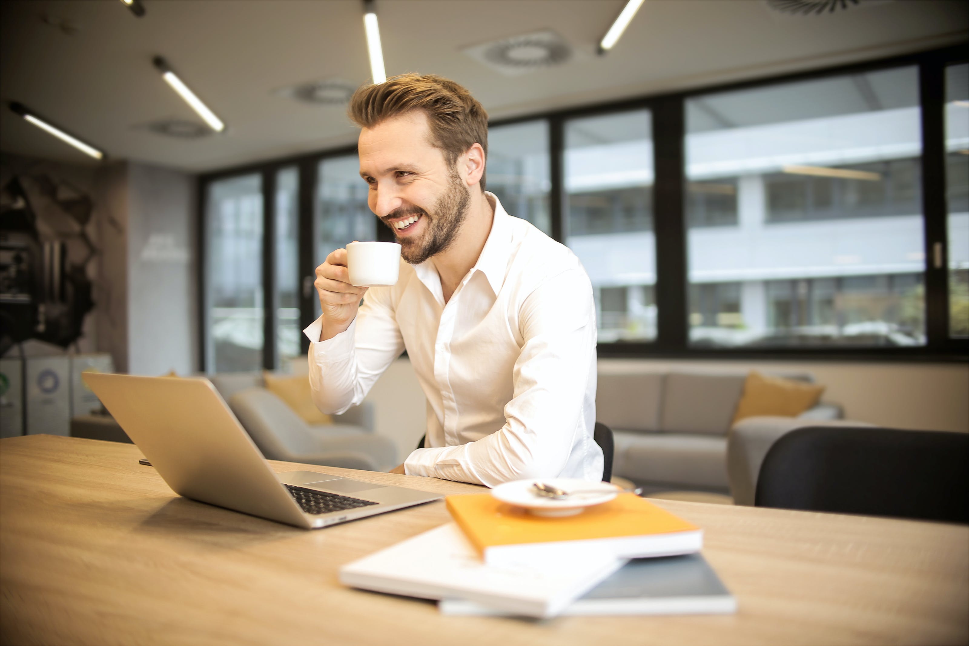 Man laughing in office.