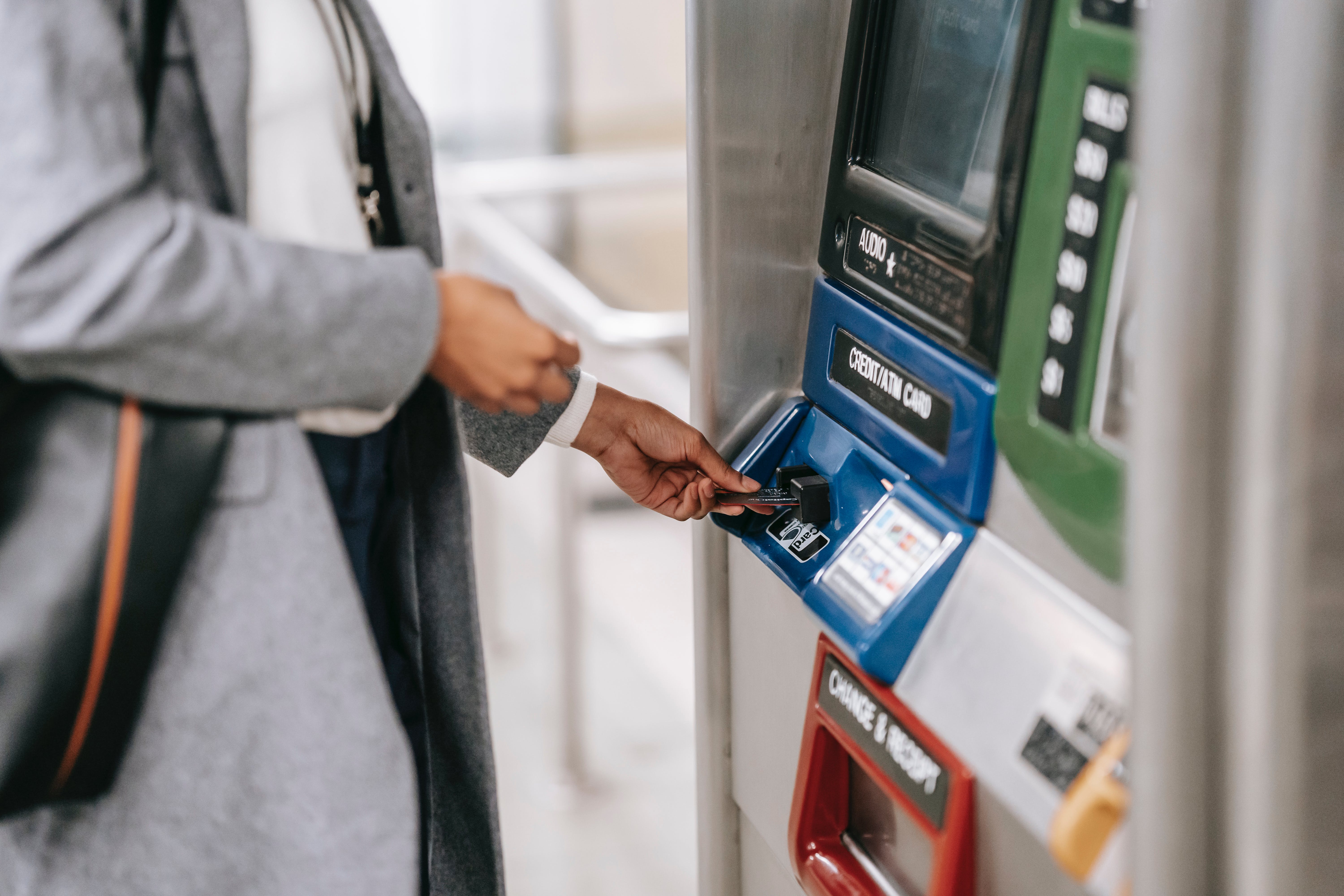 Person using bank ATM.