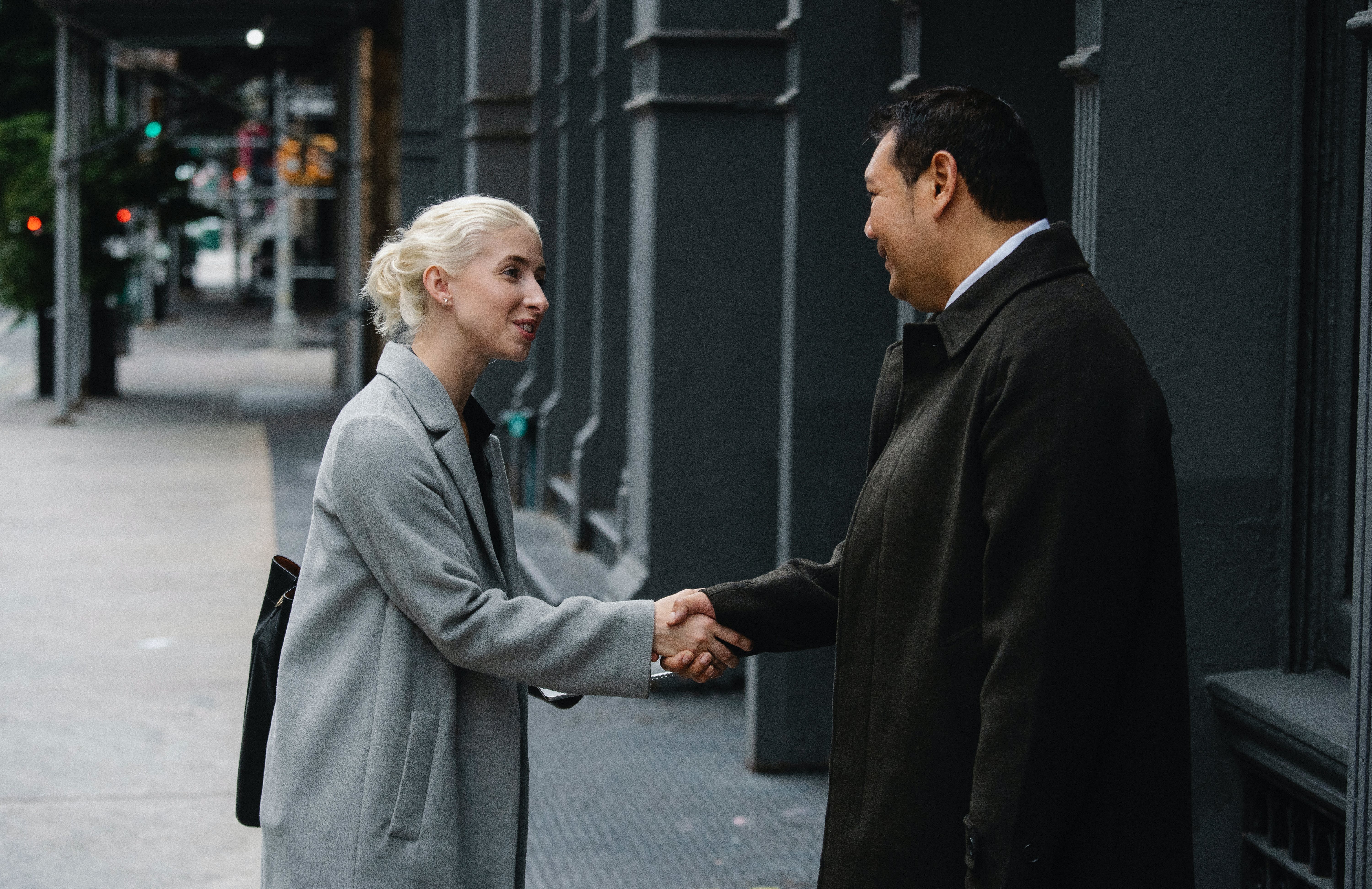Two employees shaking hands.
