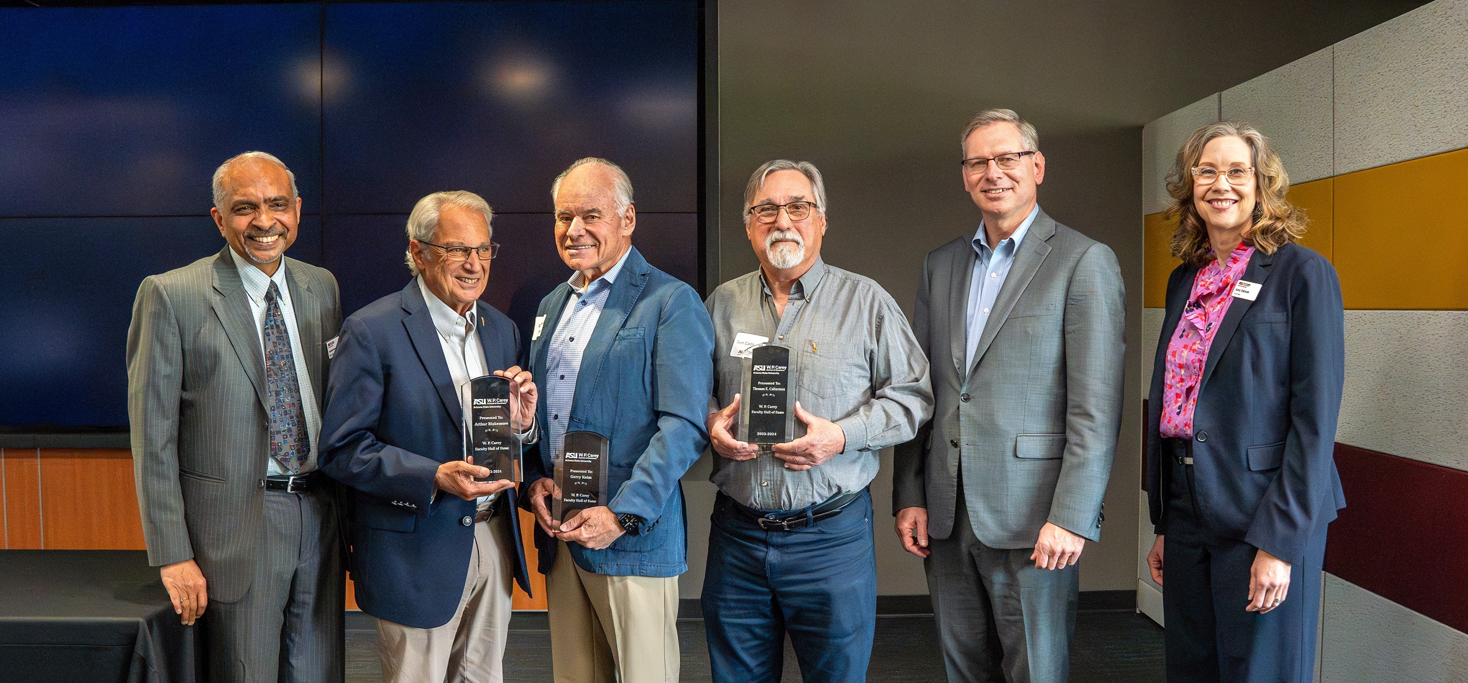 The 2024 Faculty Hall of Fame inductees accept their awards.