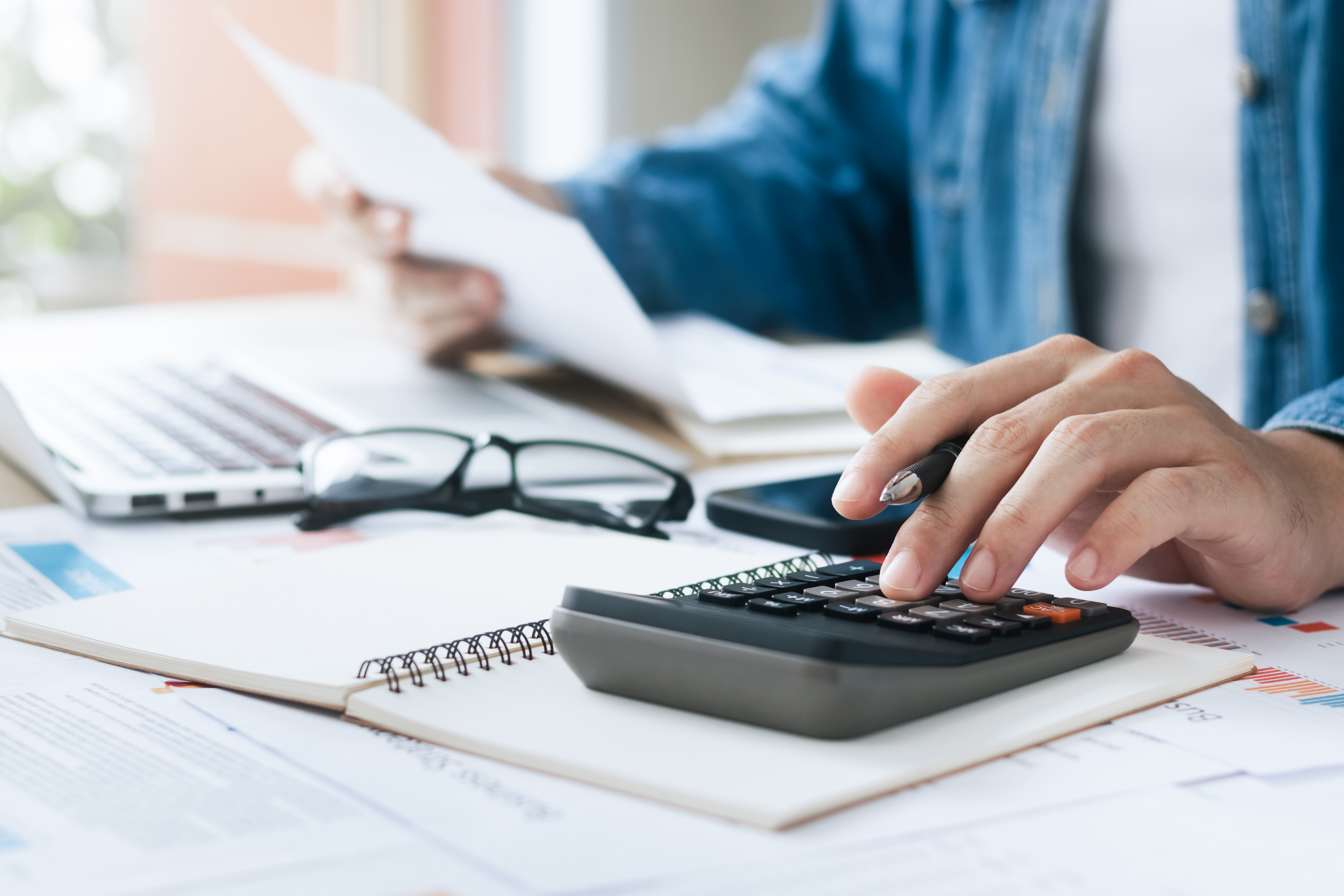 Accountant using a calculator.