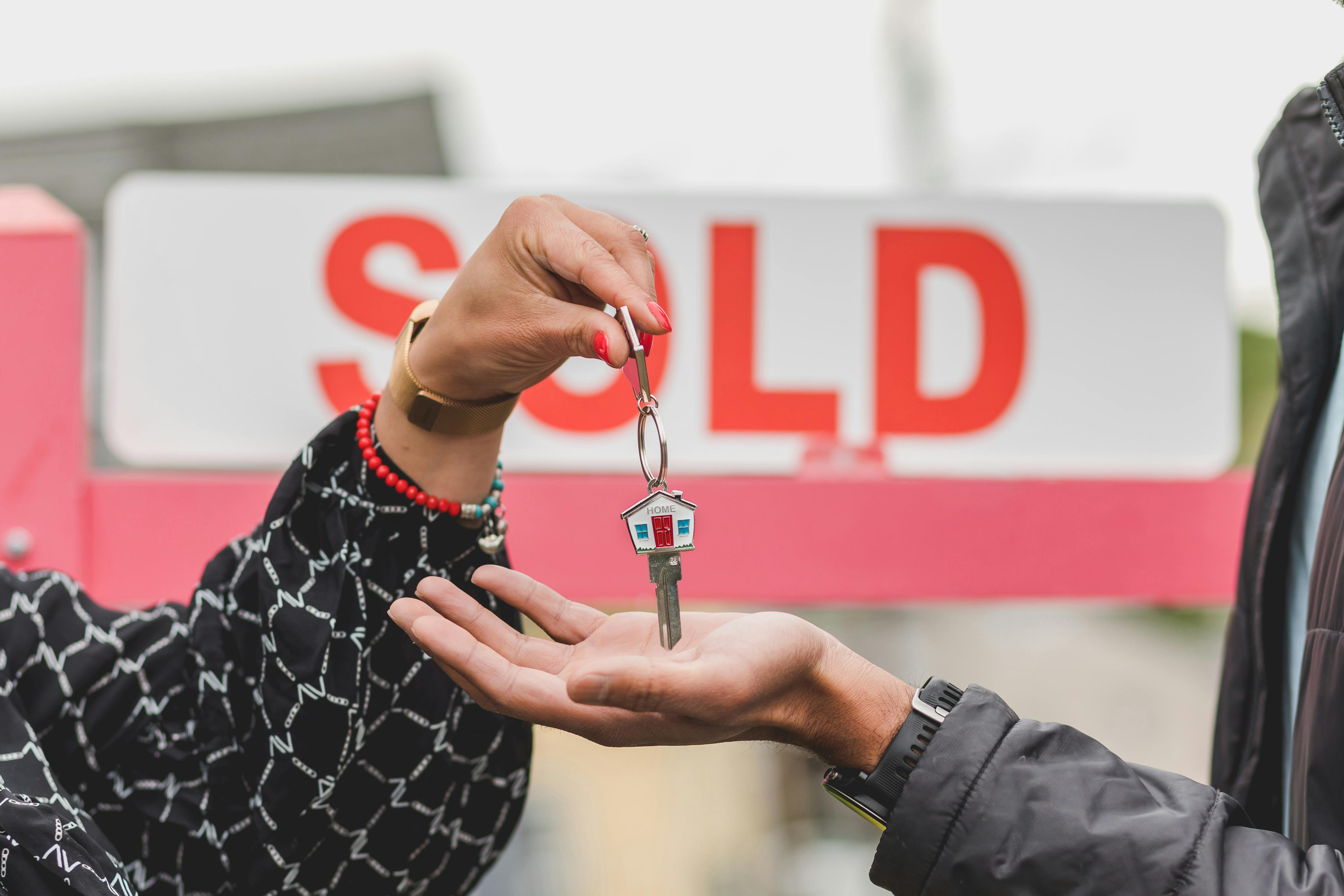 Person holding a house key.
