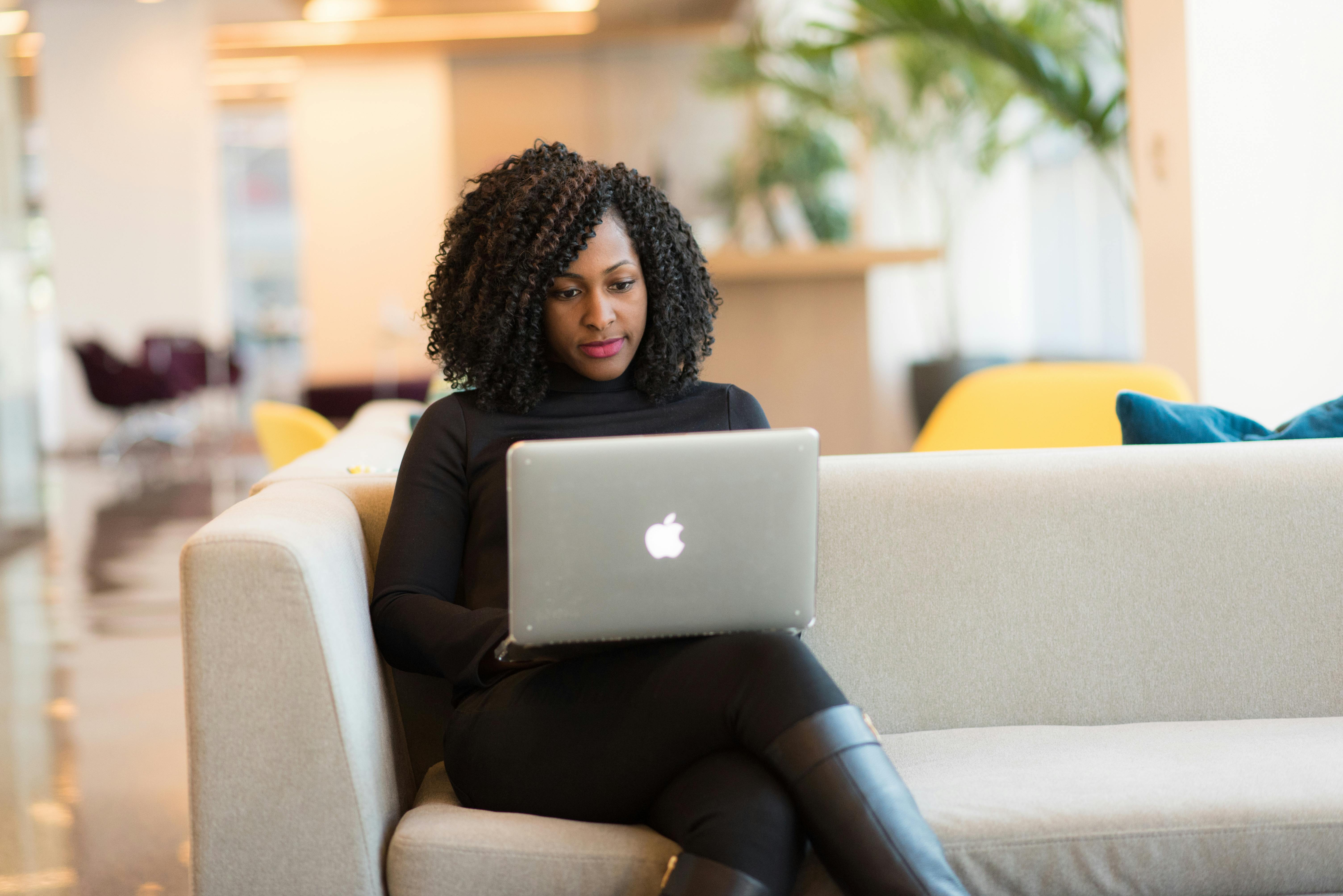 Woman working on laptop.