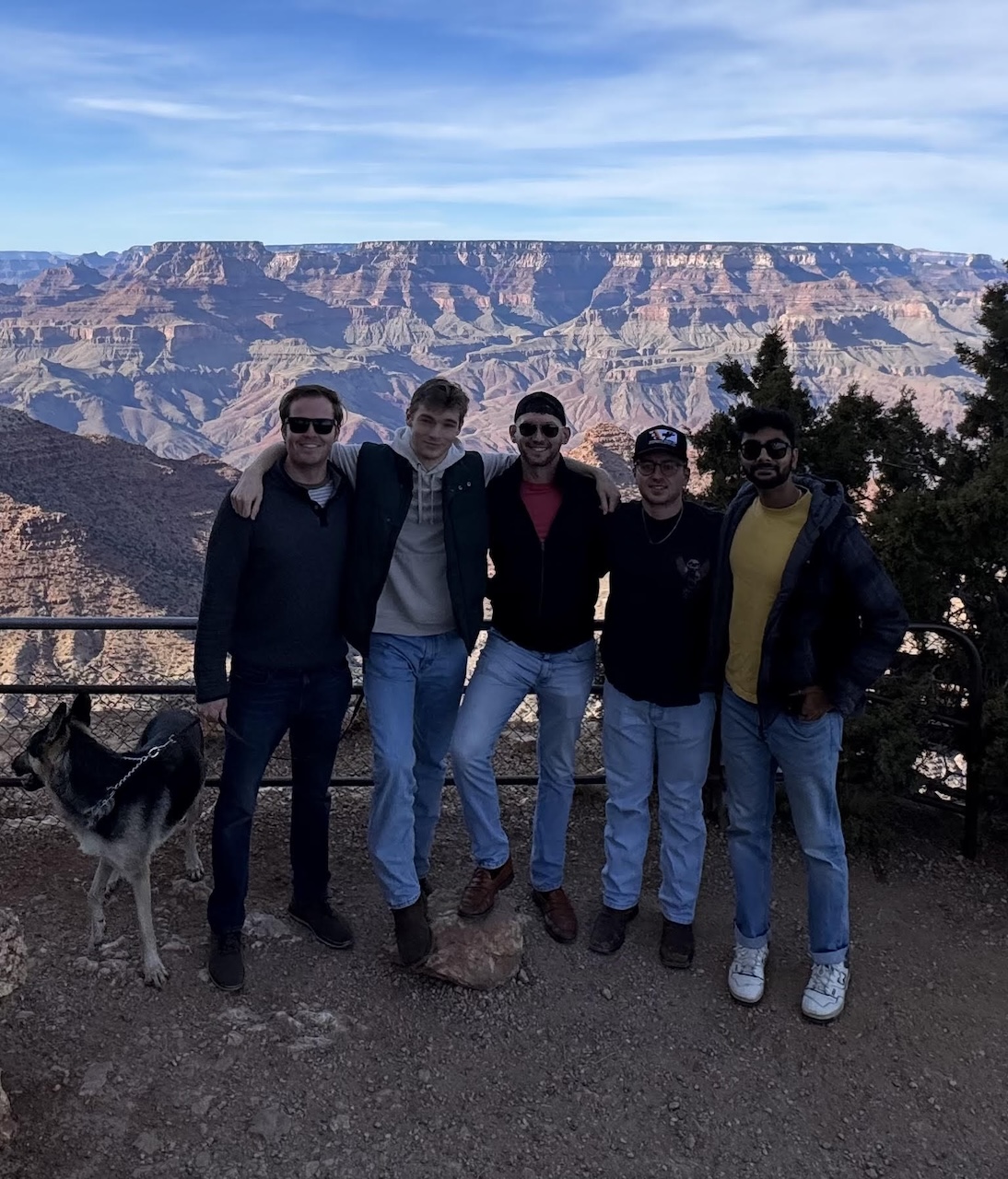 MS-FIN graduate Samuel Bowker with some of his classmates standing in front of the Grand Canyon