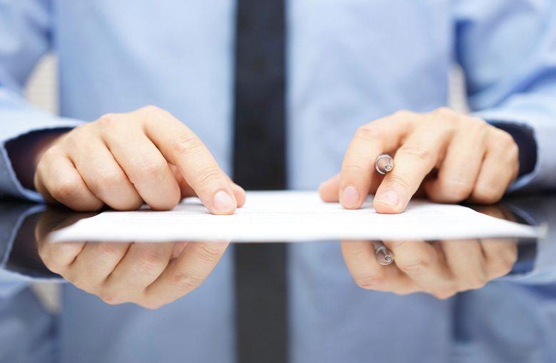 Hands-examining-contract-IDEAS.jpg Hands-examining-contract-IDEAS.jpg