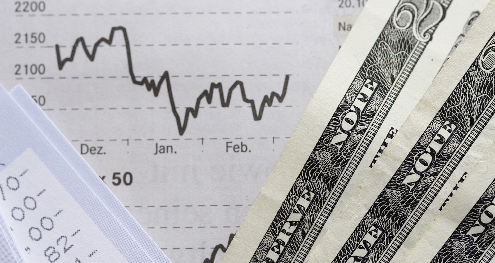 Money with line graph behind
