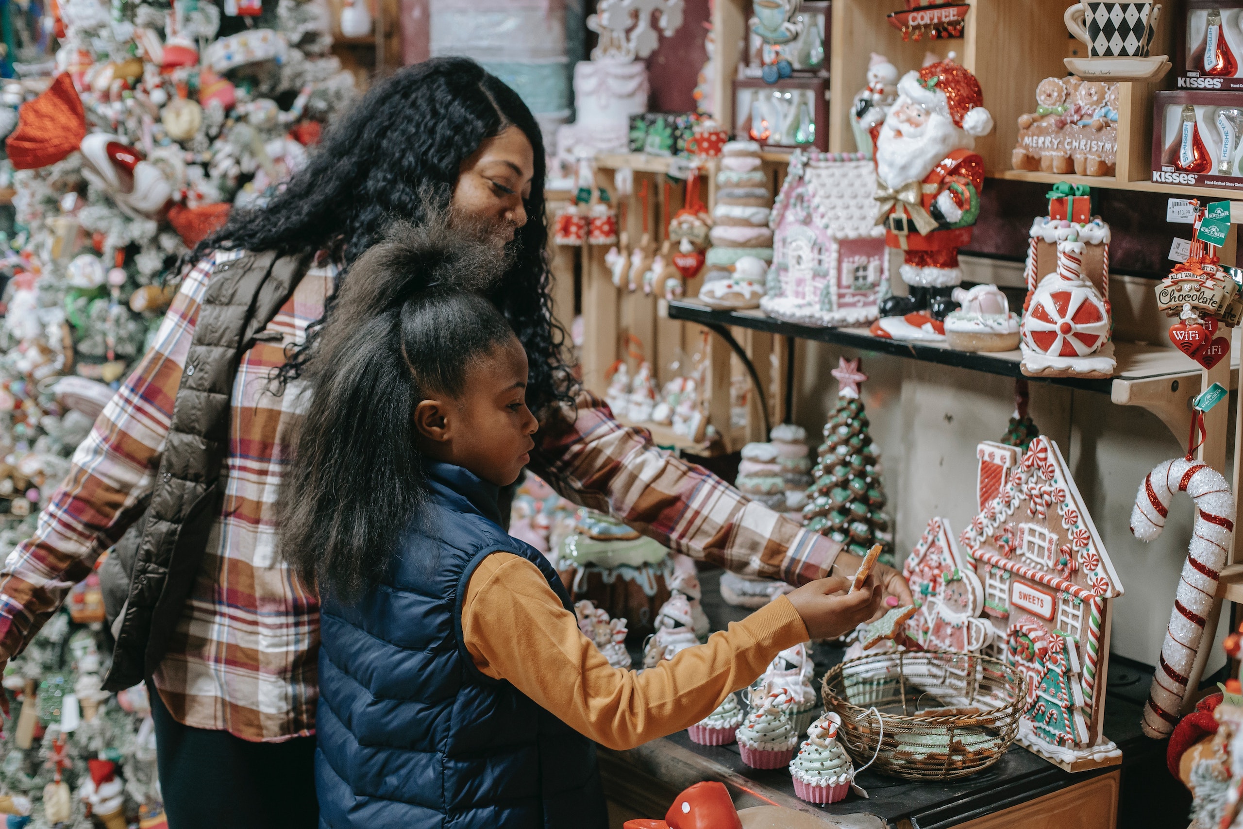 woman and young girl Christmas shopping woman and young girl Christmas shopping